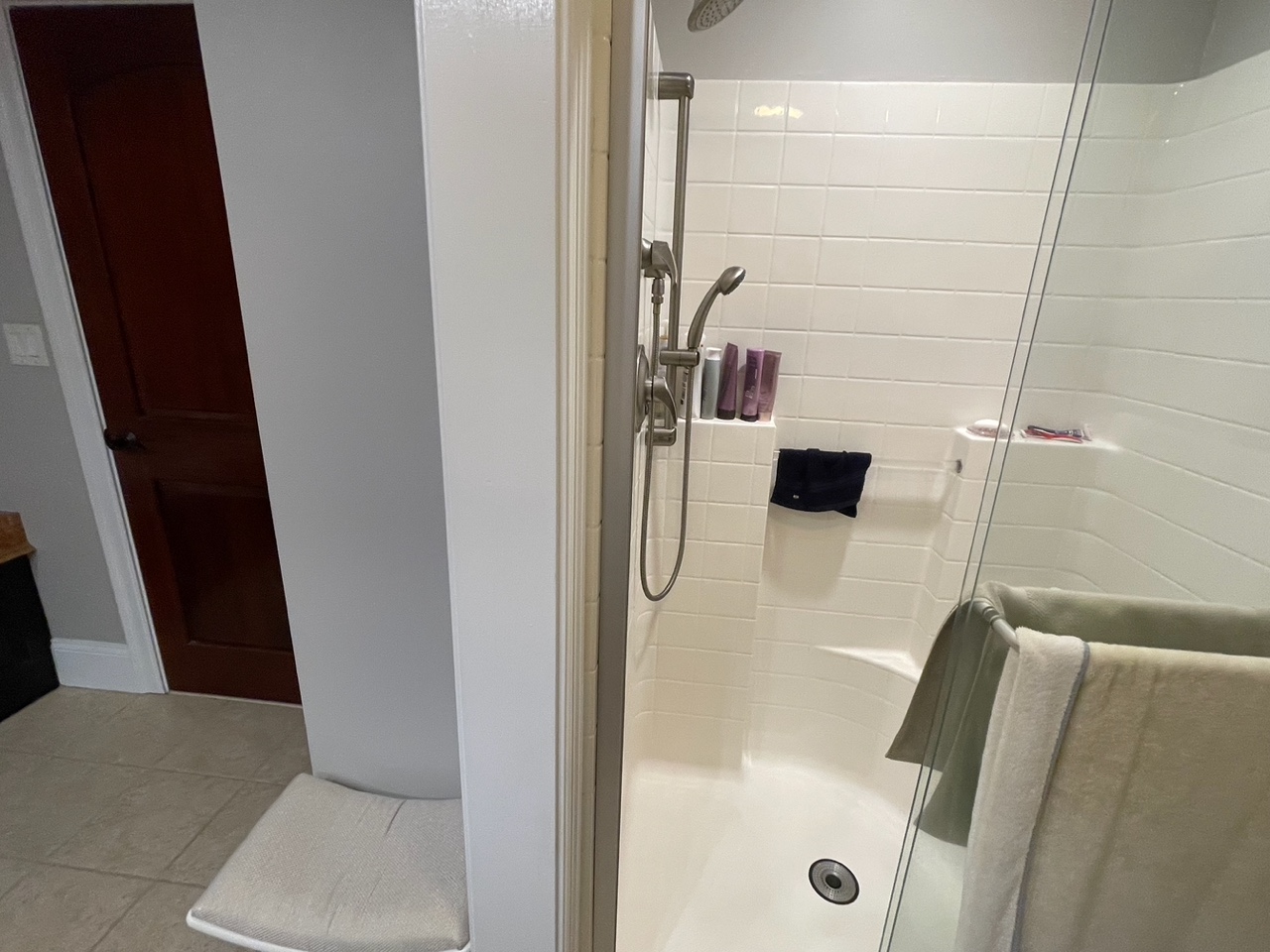 Before renovation: the original walled-off shower enclosure in the Braintree bath, before the space was opened up.