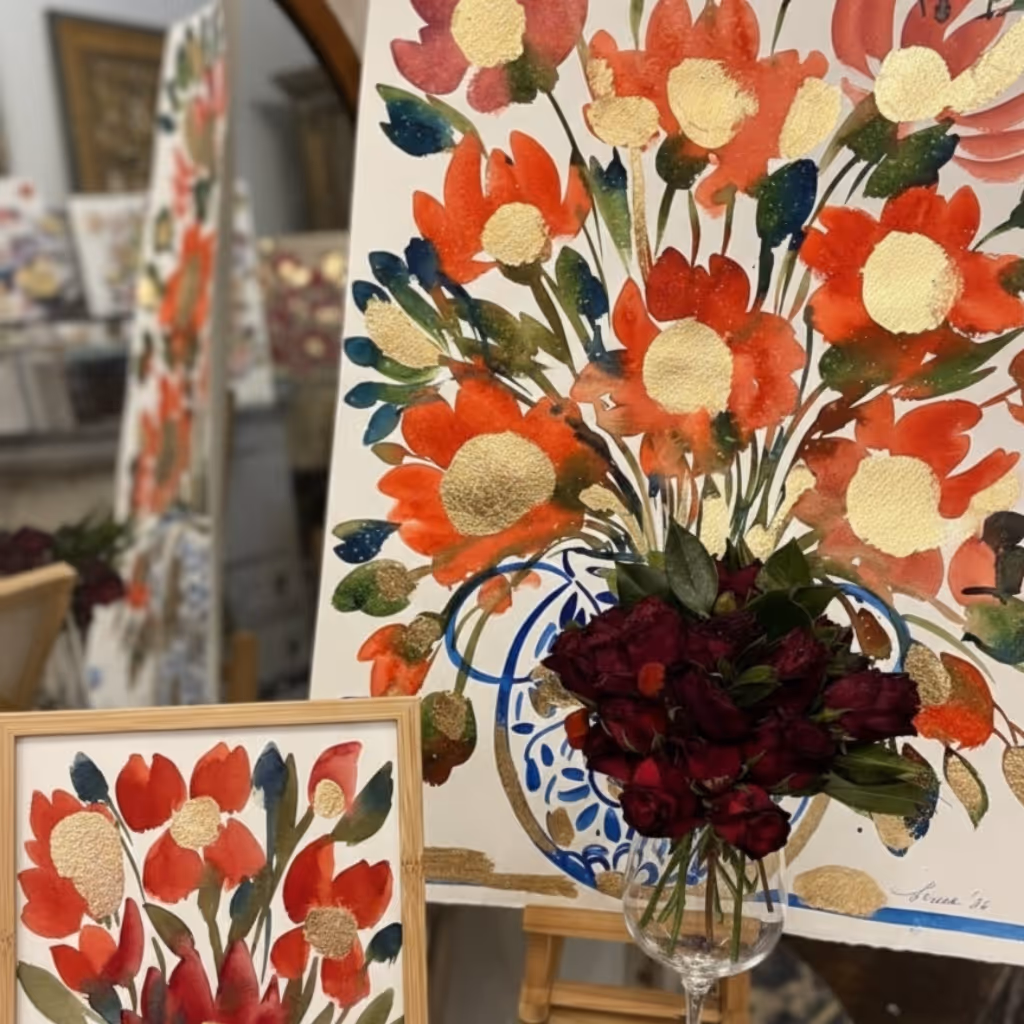A selection of floral paintings on display in Serena Bifolchi's Siena shop.