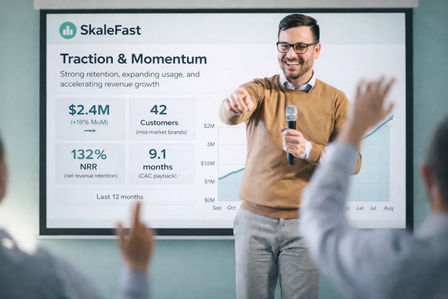 Speaker presenting traction and momentum metrics on a screen