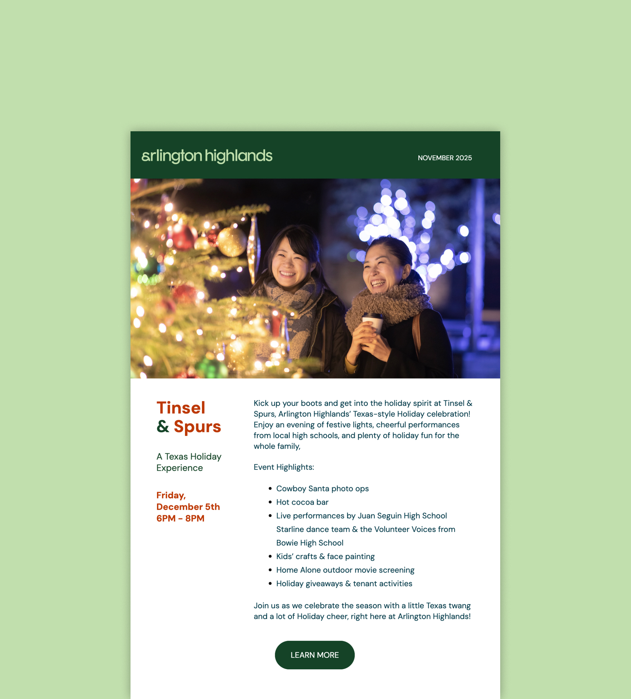 Two women smiling near a decorated Christmas tree with lights and ornaments at night.