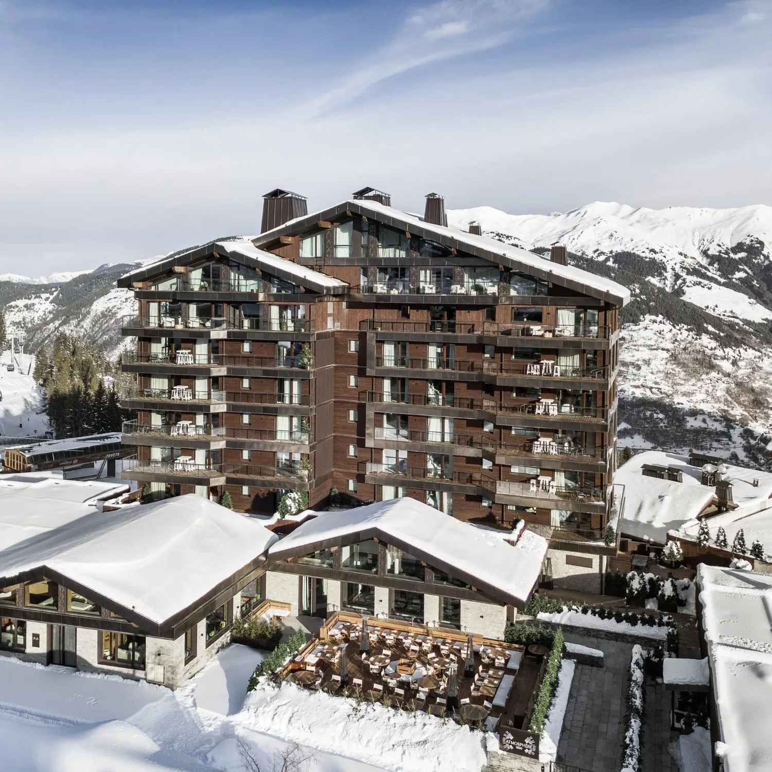 Panoramic view of the festive ChaCha restaurant and the terrace at the foot of the Atmosphere 1850 residence in Courchevel 1850.