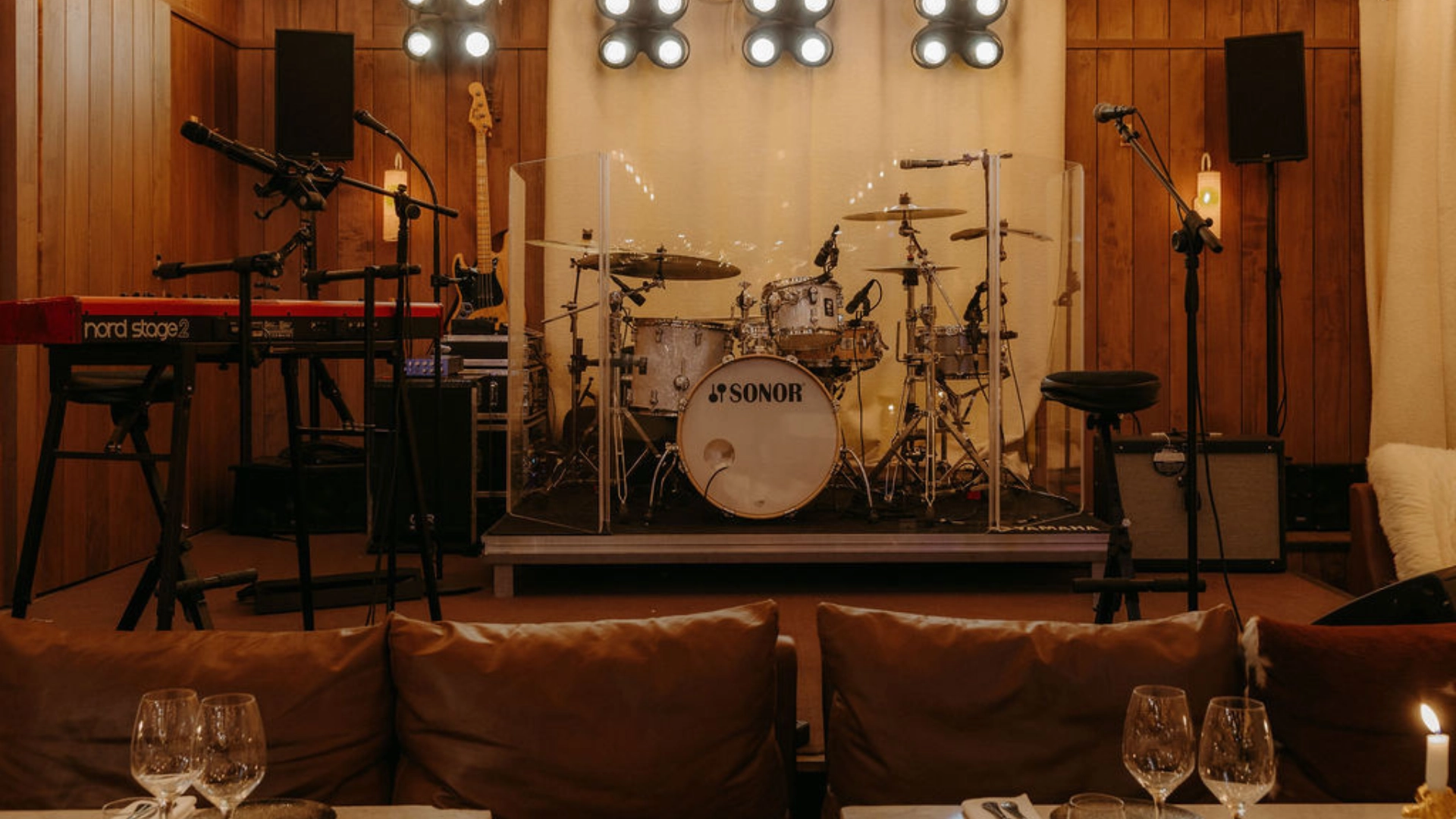 A music stage equipped for live performances at the ChaCha restaurant in Megève, an Annie Famose Group (AFGroupe) establishment, offering a plush and intimate atmosphere.