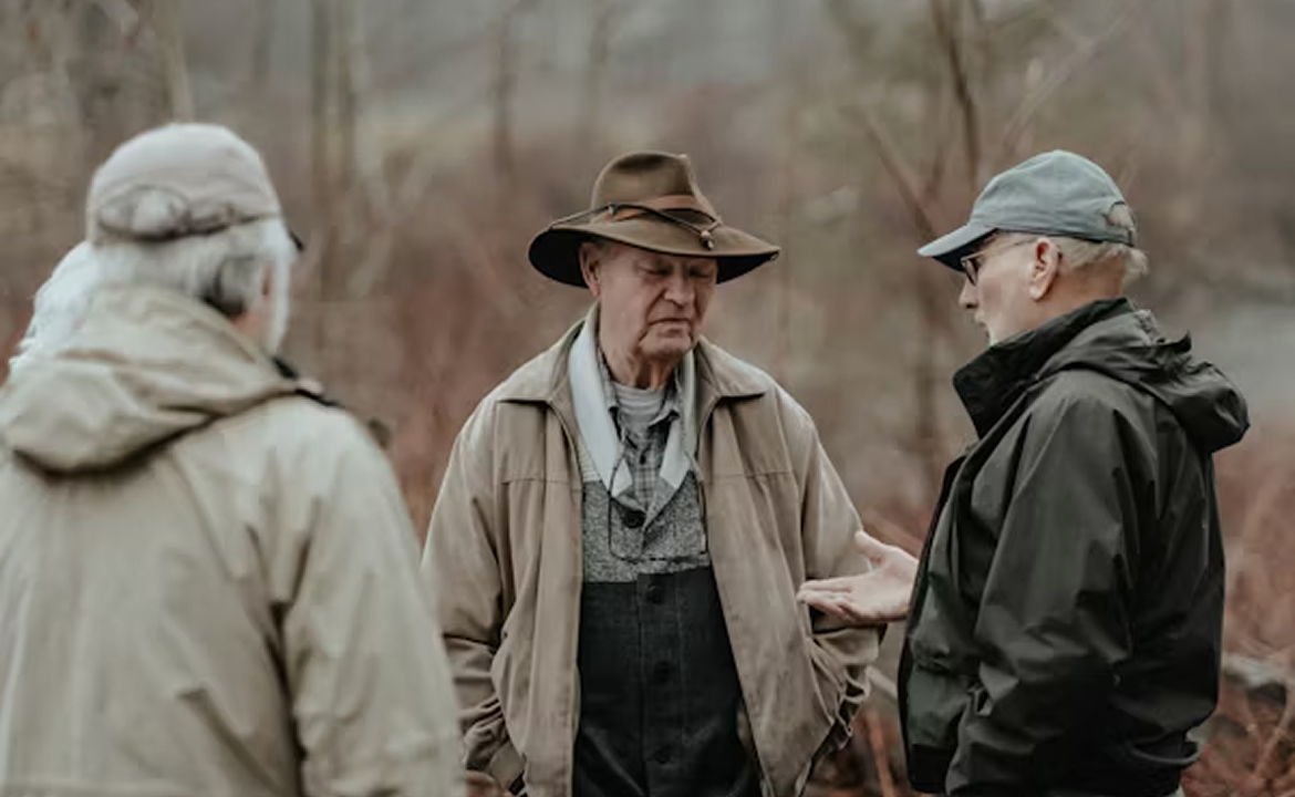 Three people standing.