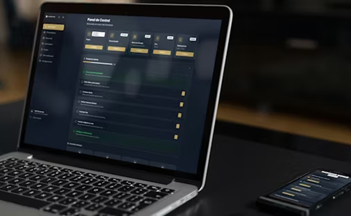 Laptop and smartphone displaying a dark-themed control panel dashboard with navigation menus and settings.