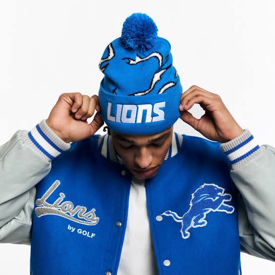 Model wearing the Lions by GOLF varsity jacket and matching beanie