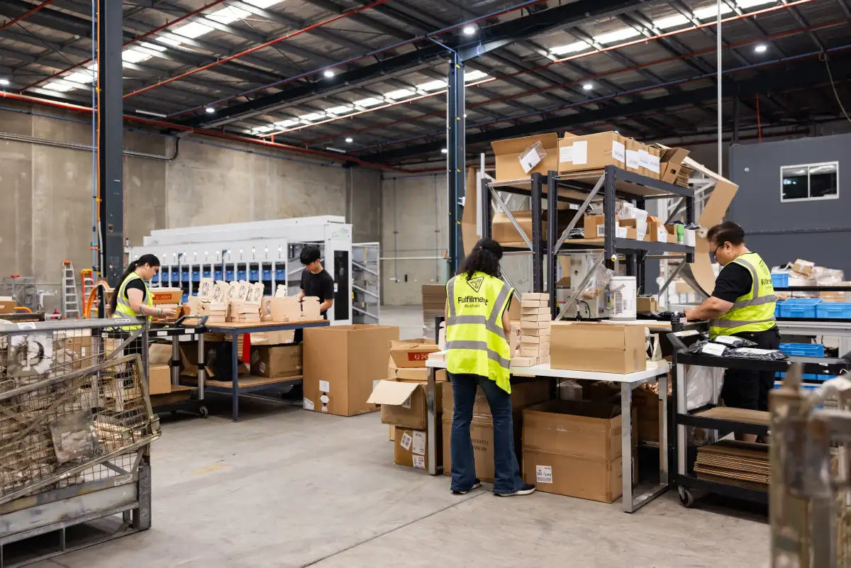 Fulfilment Australia team packing ecommerce orders at the warehouse packing benches