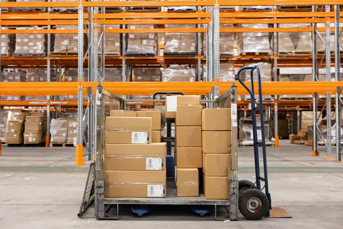 Stock cage and hand trolley loaded with cartons in the Fulfilment Australia warehouse