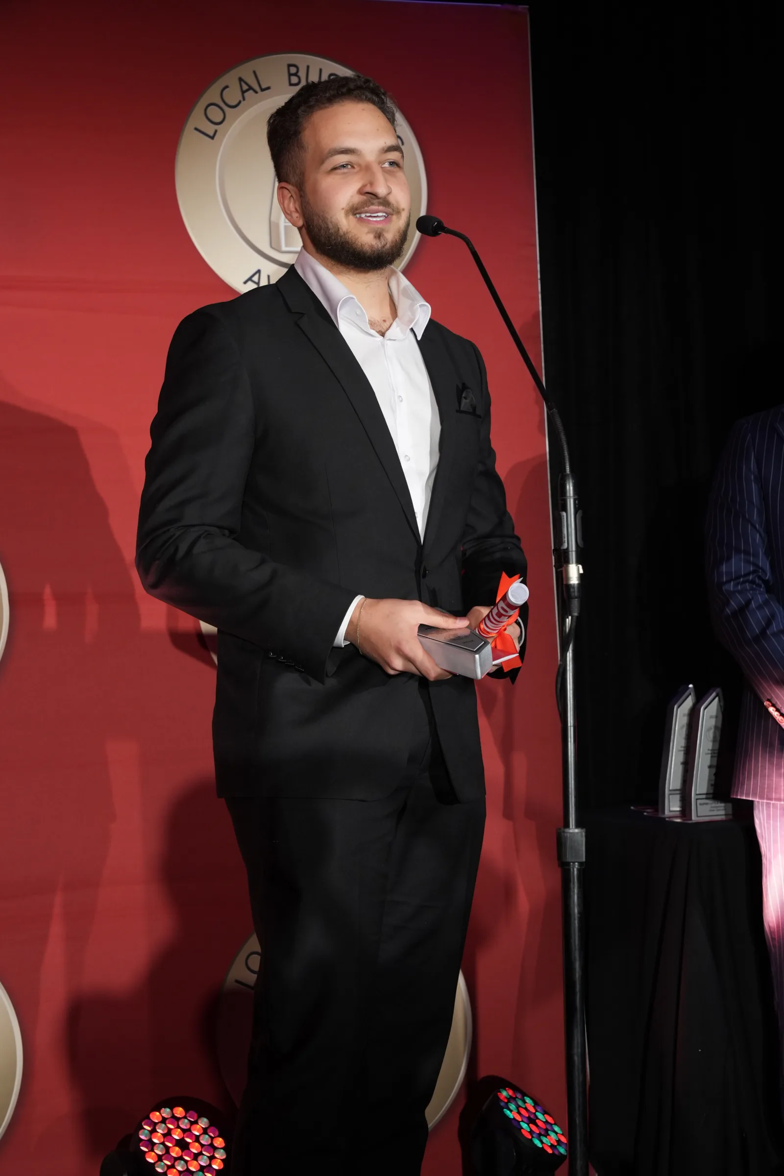 Accepting the Outstanding Specialised Business award on stage at the Parramatta Local Business Awards
