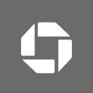Abstract white geometric logo formed by four polygonal shapes on a gray background.