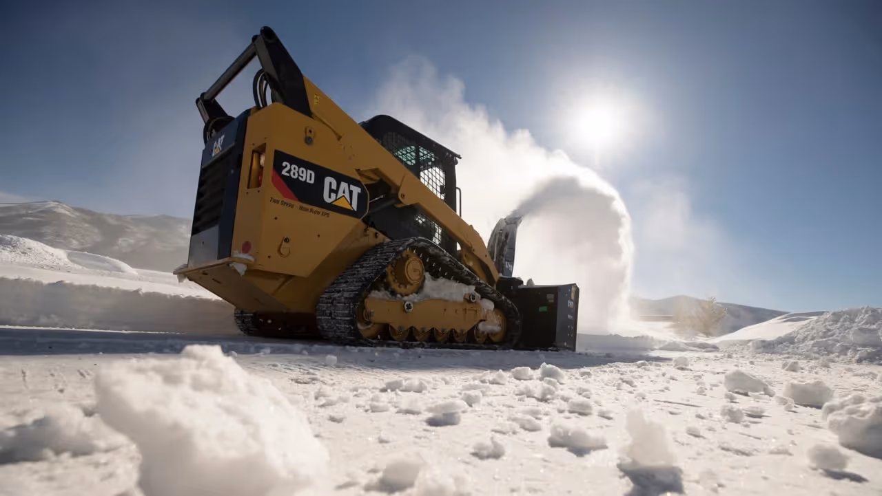 skid loader snow plowing commercial lot