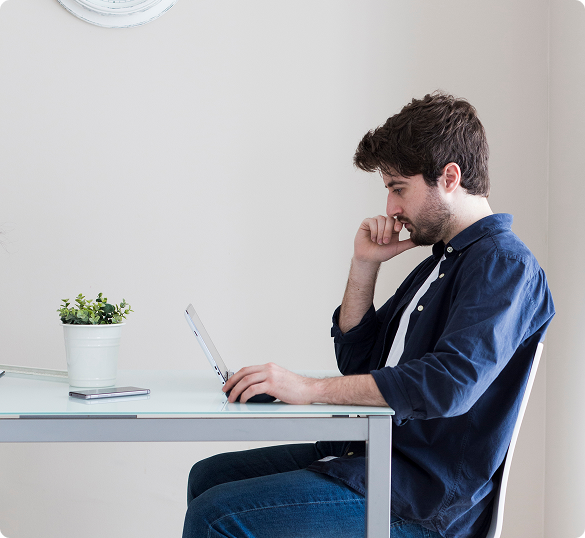 Human hand reaching out to touch a robot hand against a neutral gray background.