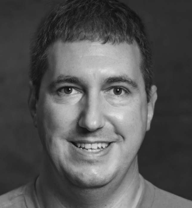 [headshot] image of satisfied student using a laptop