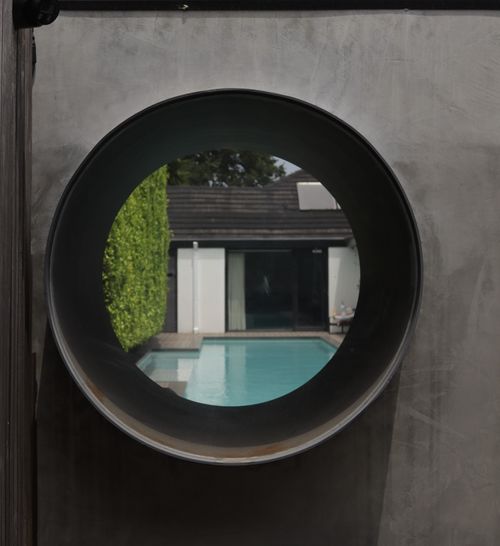Artistic look-through window into outdoor landscape
