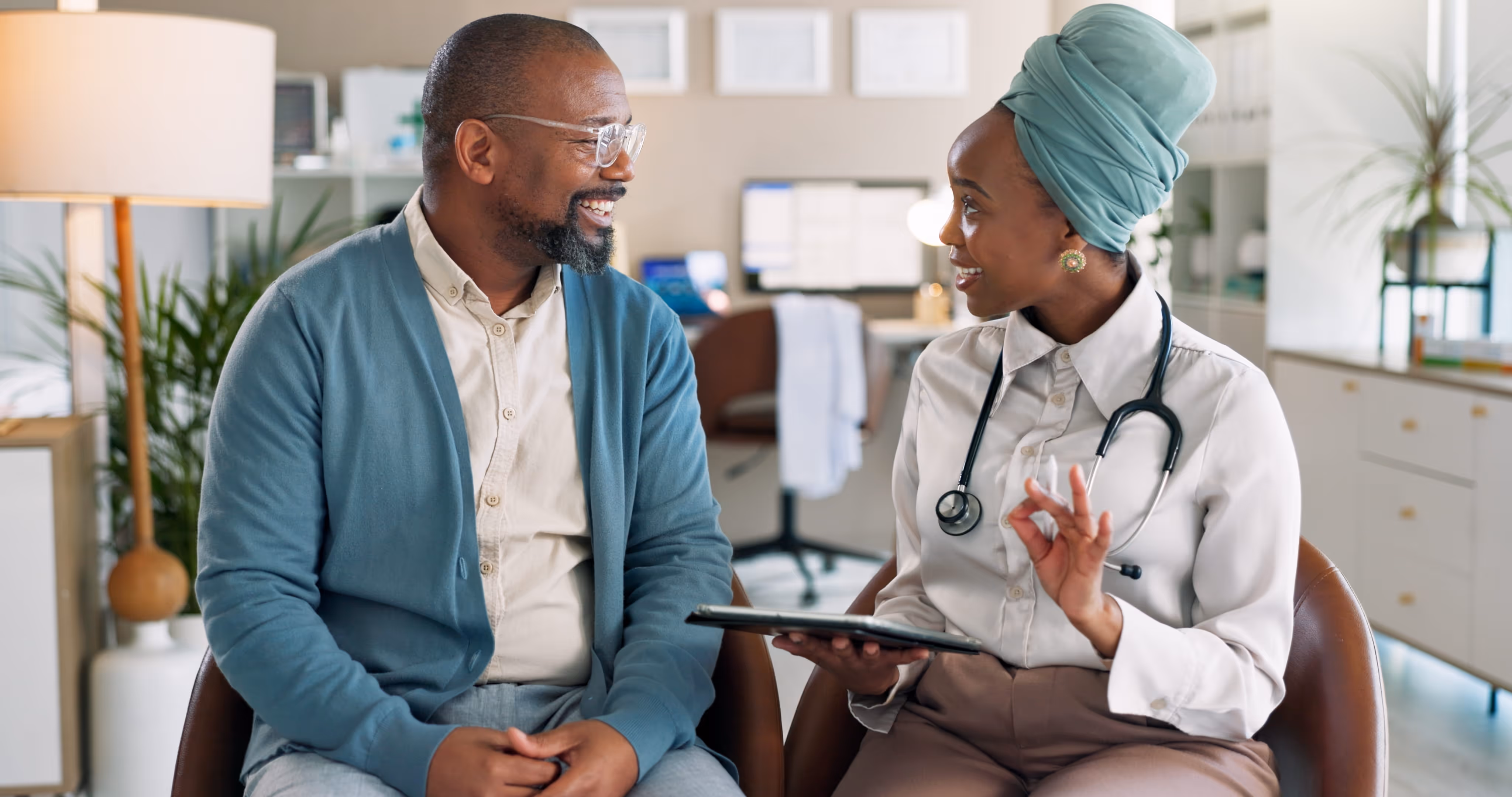 A female doctor speaks with a patient