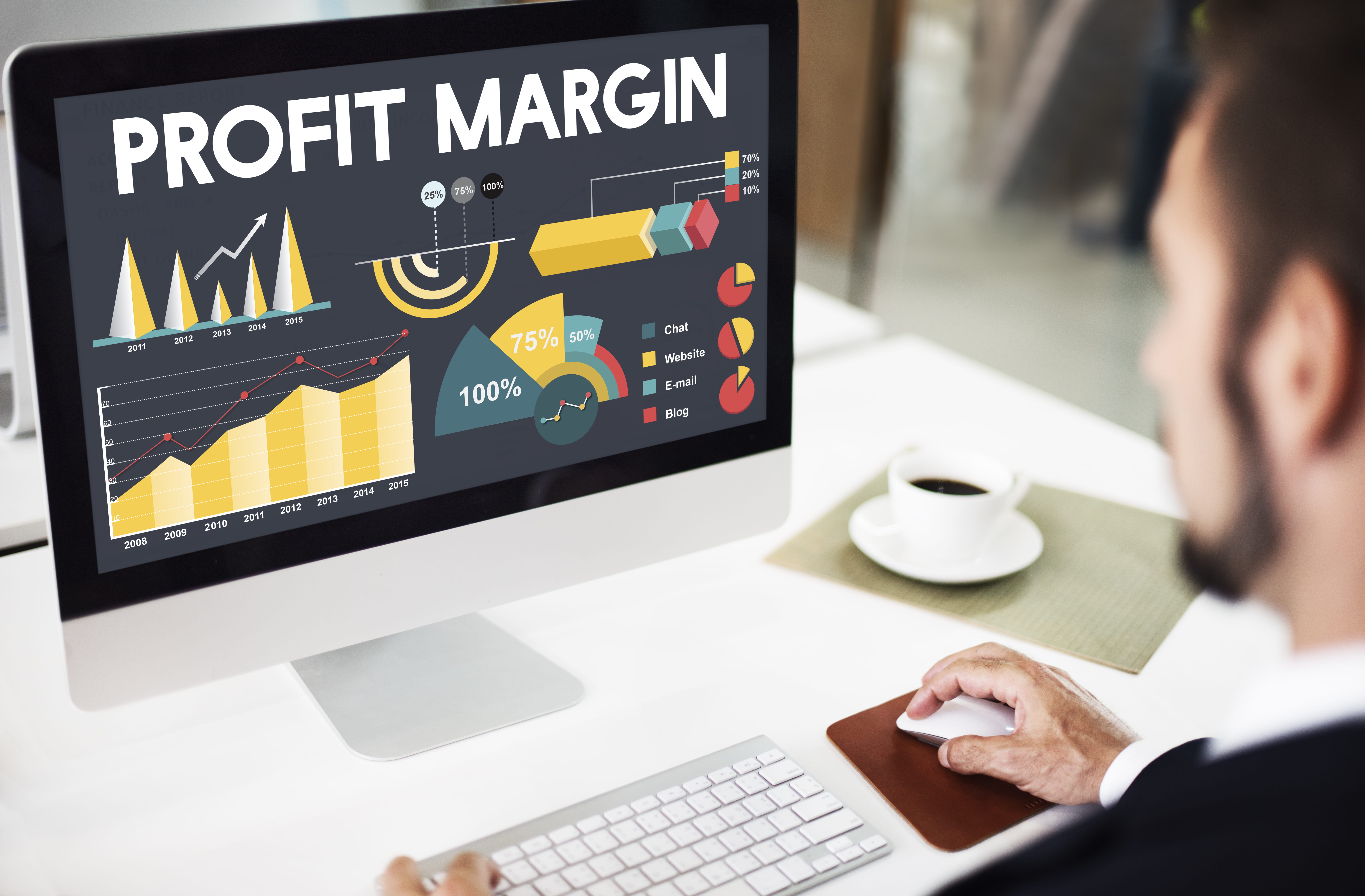 a man stares at the monitor with data showing on the screen