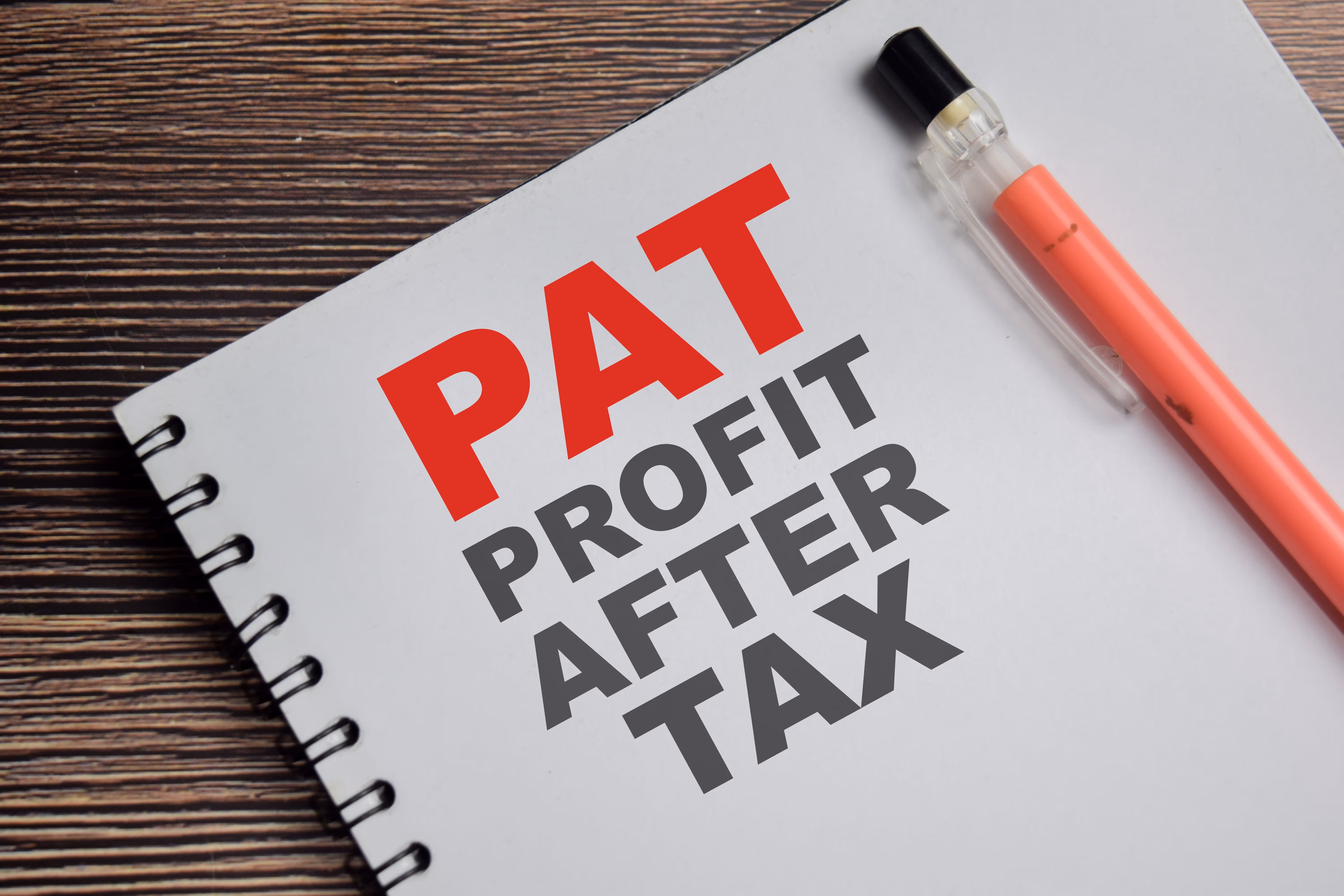 A sheet with PAT Profit After Tax written on it