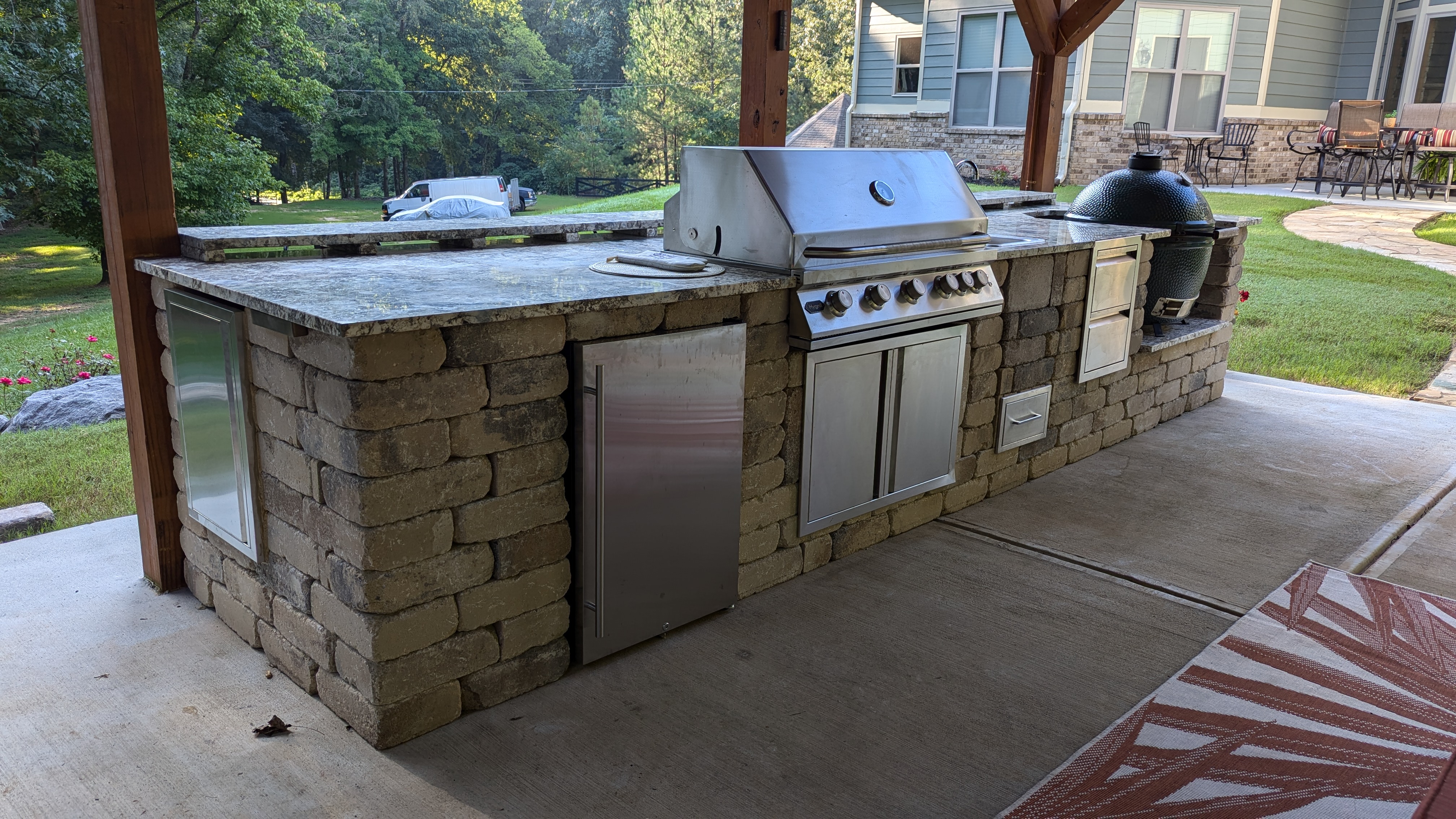 Beautiful backyard with custom patio, fire pit, and landscaping in Marietta GA