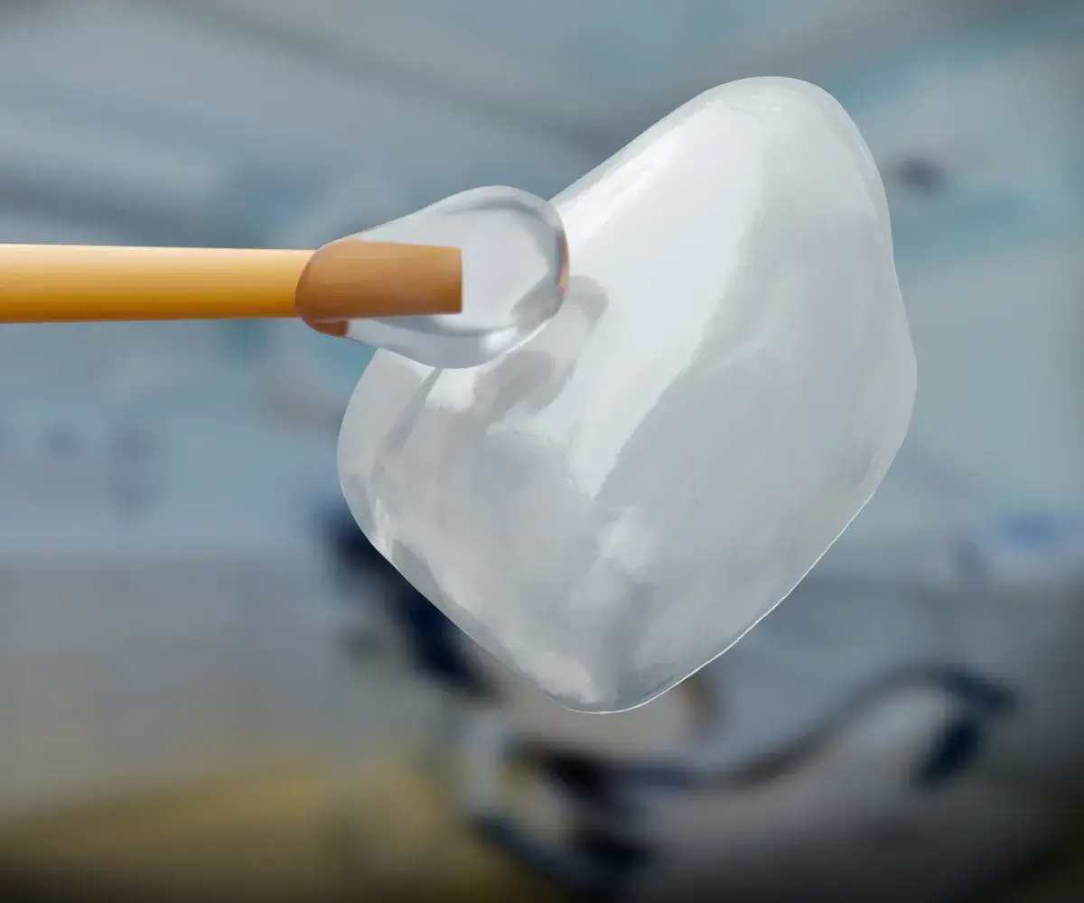 A close up of a toothbrush with a toothpaste on it.