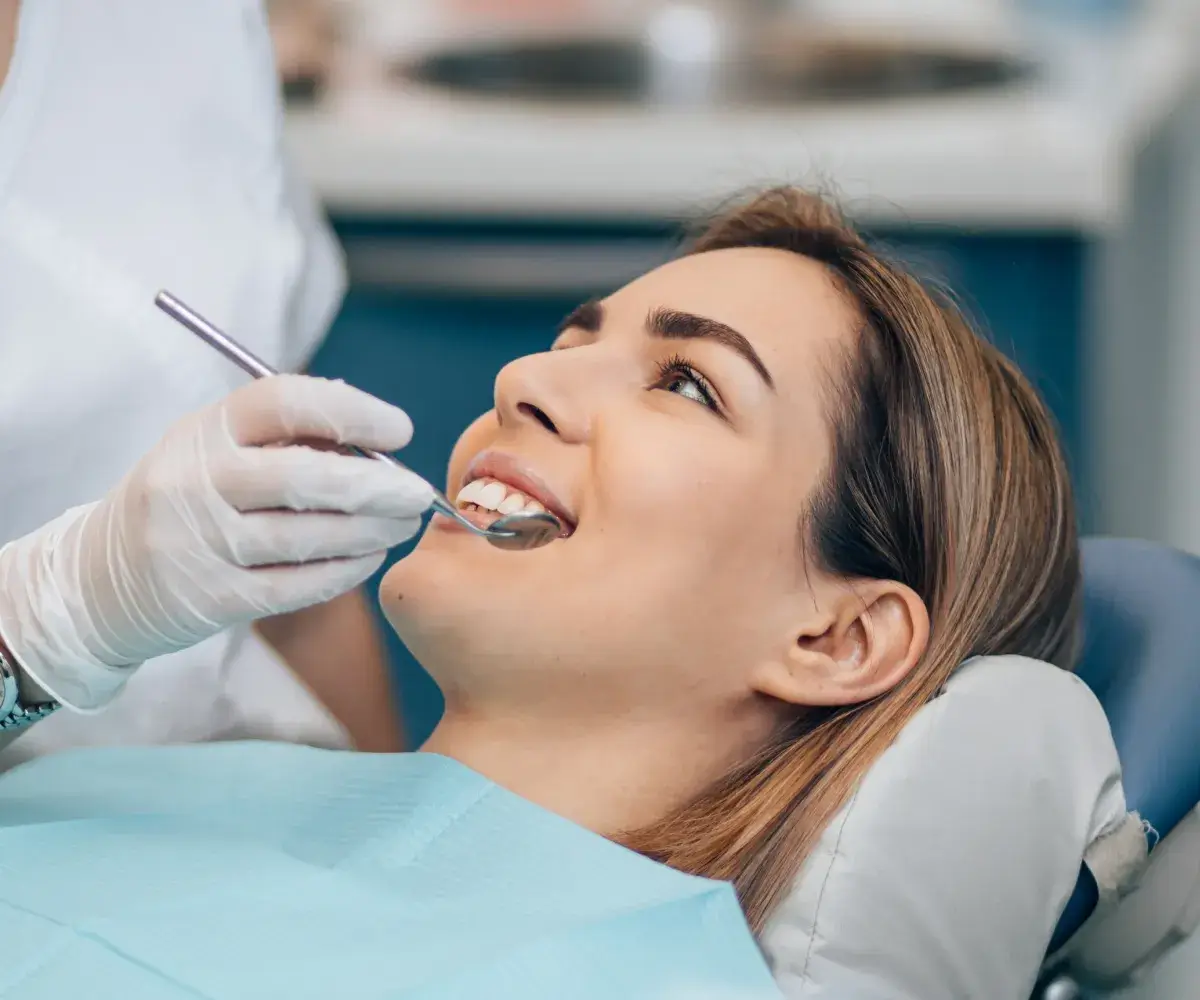 Woman having her teeth checked.