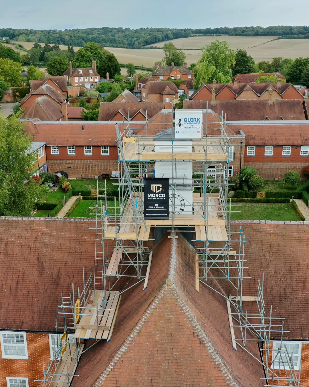 Drone view of scaffolding erected over a tiled roof on a Morco project