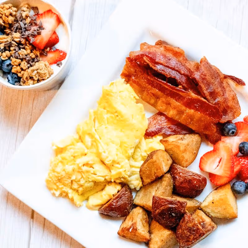 Scrambled eggs with potatoes on the side