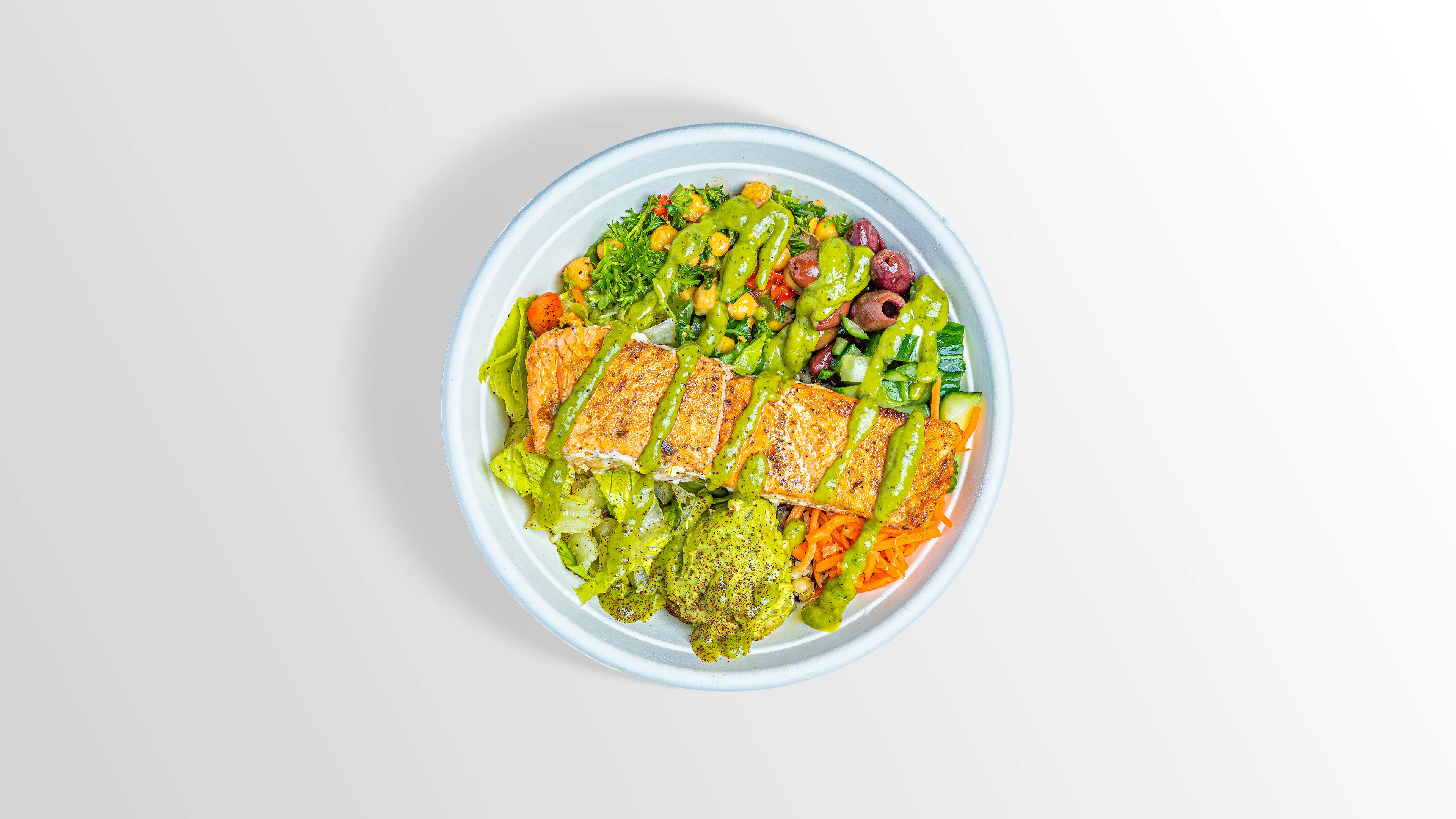 Salmon Bowl with quinoa, chickpea salad, kalamata olives and guacamole