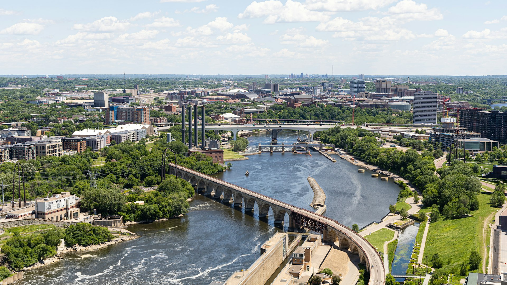 Aerial view of downtown Minneapolis and the Stone Arch Bridge