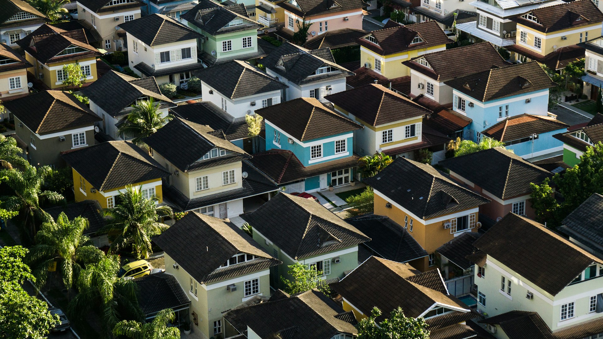 Aerial view of a suburban neighborhood with rows of houses