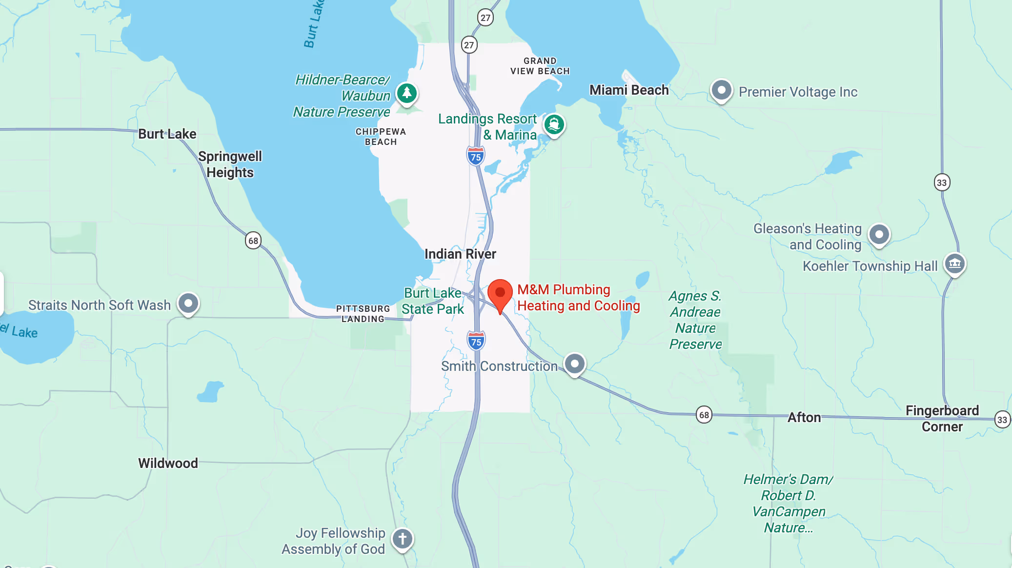 Map showing M&M Plumbing Heating and Cooling location near Burt Lake State Park, Indian River, and Miami Beach with surrounding landmarks and roads.