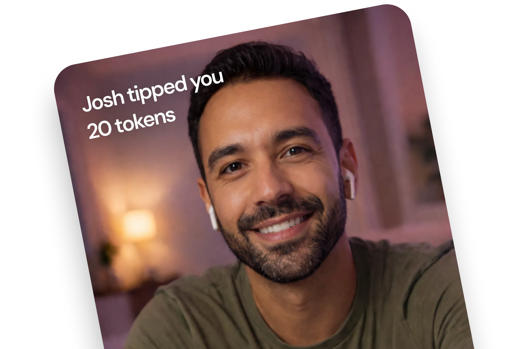 A man with a beard smiling at the camera.