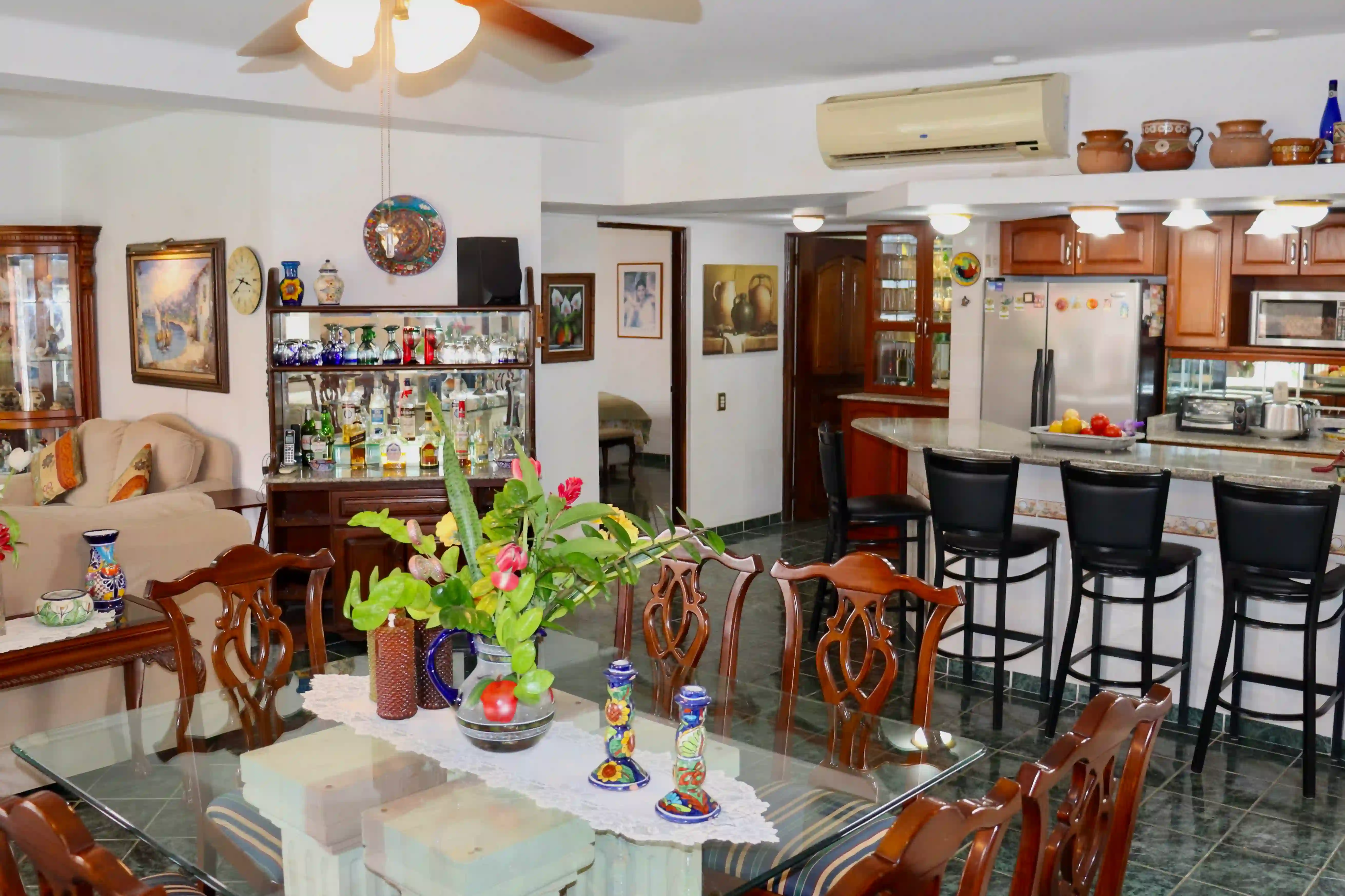 Detail of the high-quality wooden furniture and built-in shelving in the living area, reflecting the classic craftsmanship and upscale feel of this Marina Vallarta condo.