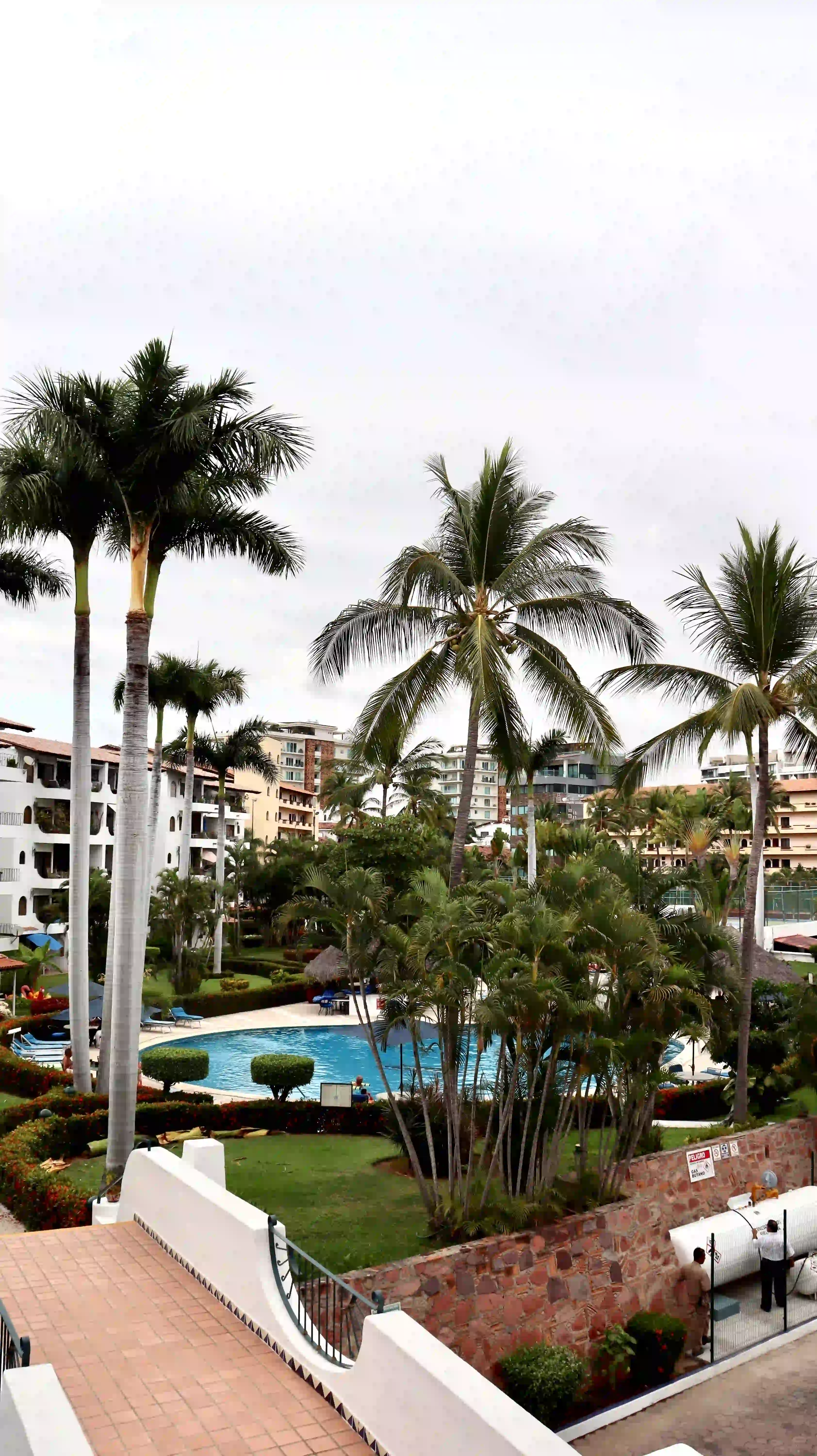 Wide-angle view of the pristine pool area and shared amenities, highlighting the luxury vacation lifestyle of the Marina Vallarta development.
