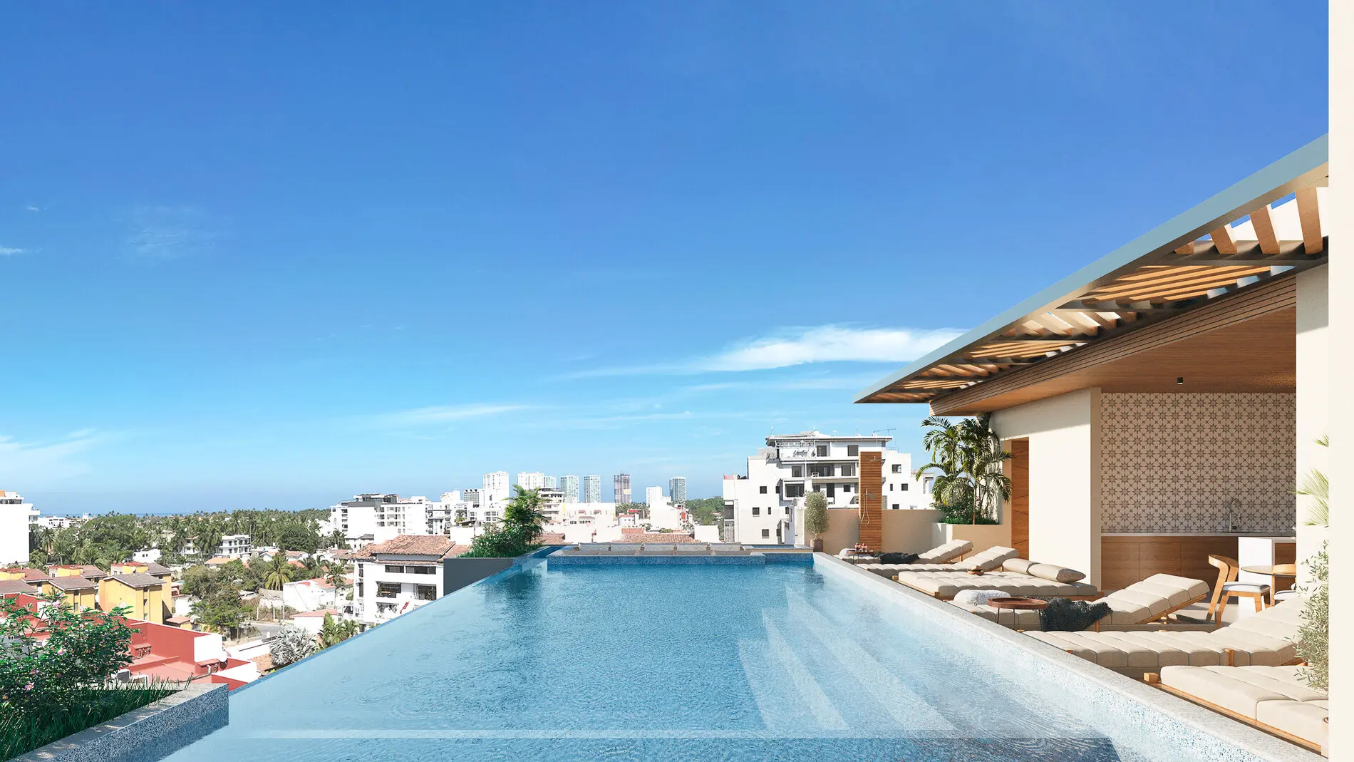 Luxury rooftop lap pool at Terra 242 overlooking Banderas Bay and the Puerto Vallarta skyline.