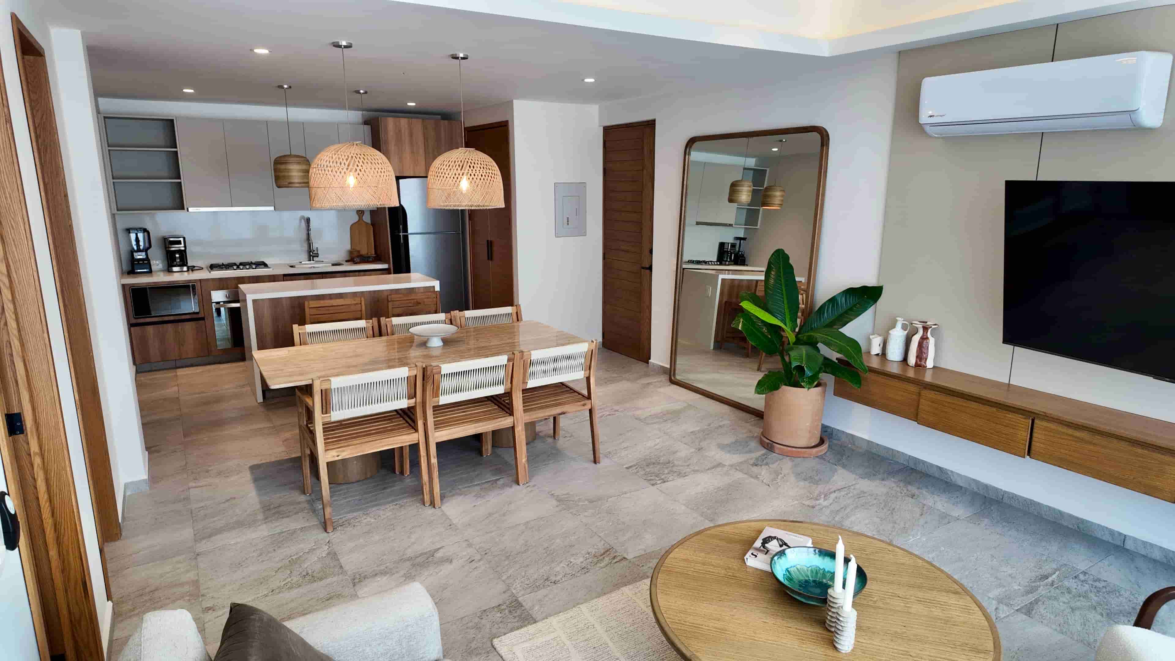 Wide-angle view of the fully decorated dining and living area in TERRA 242, showcasing functional and sophisticated space utilization.