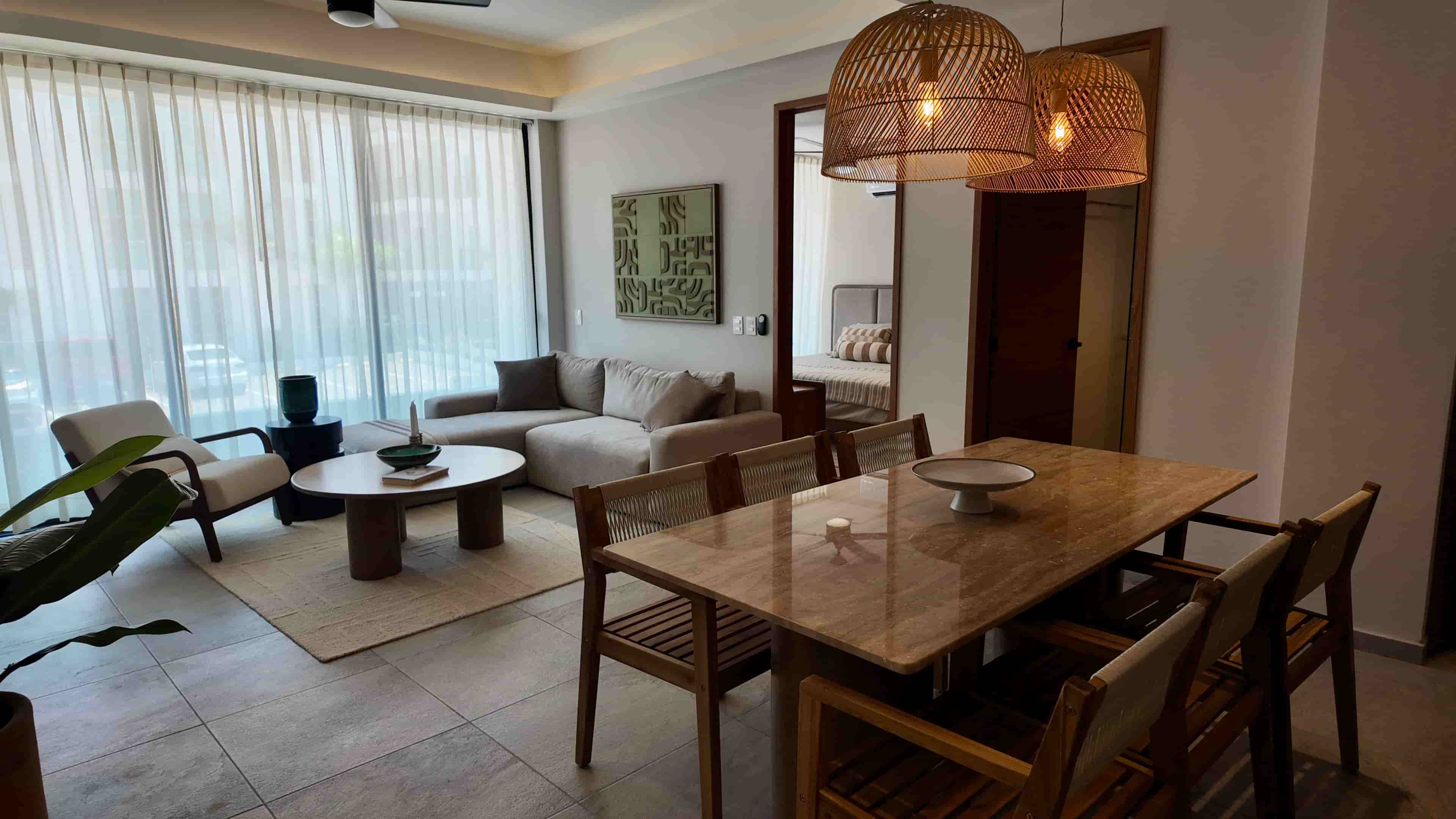 Warmly lit dining area next to the main living space in TERRA 242, reflecting a premium rental-ready residential design.