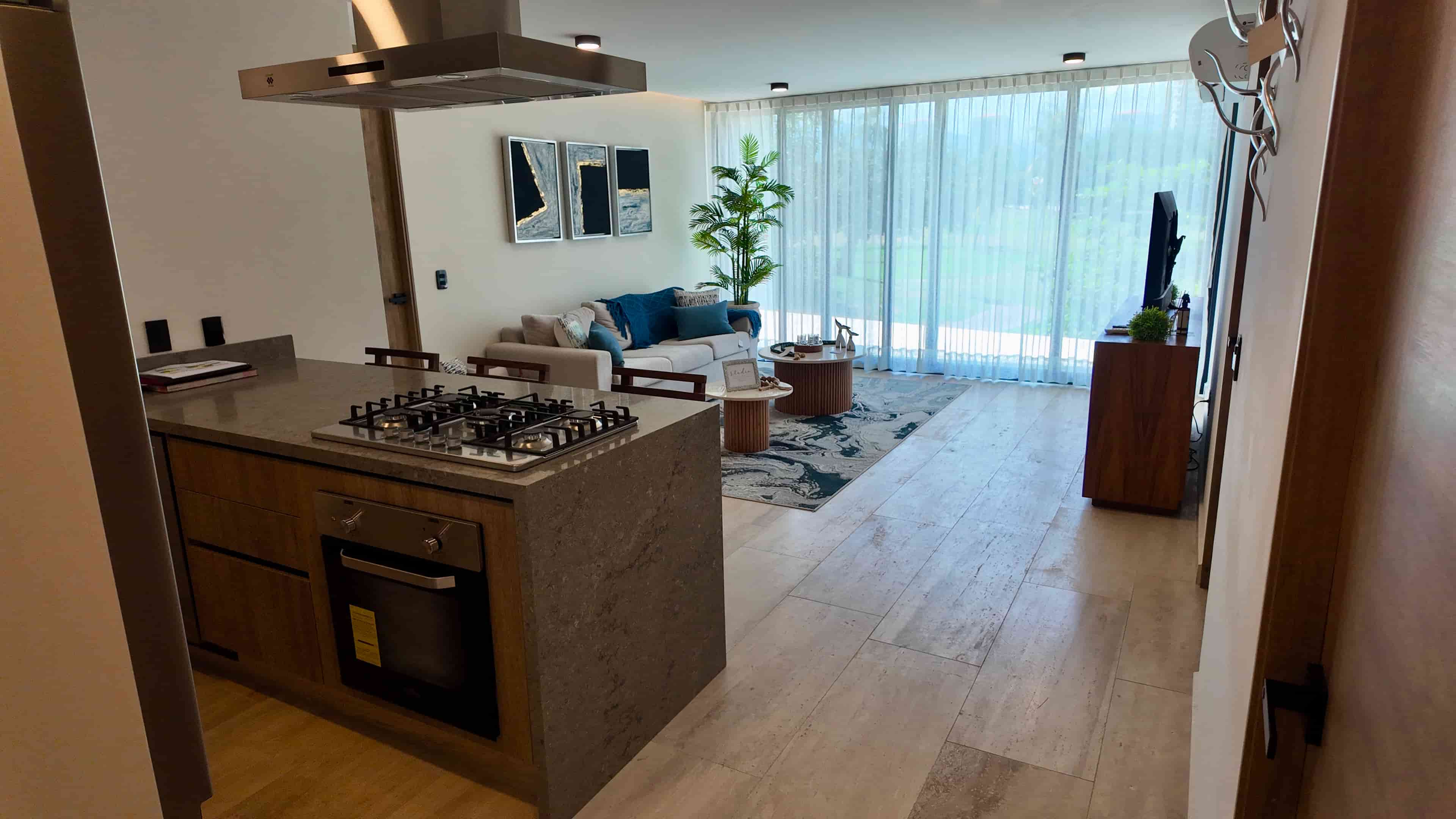Gourmet kitchen with a central island and granite countertops in the fully furnished Batros Marina Residences showroom.