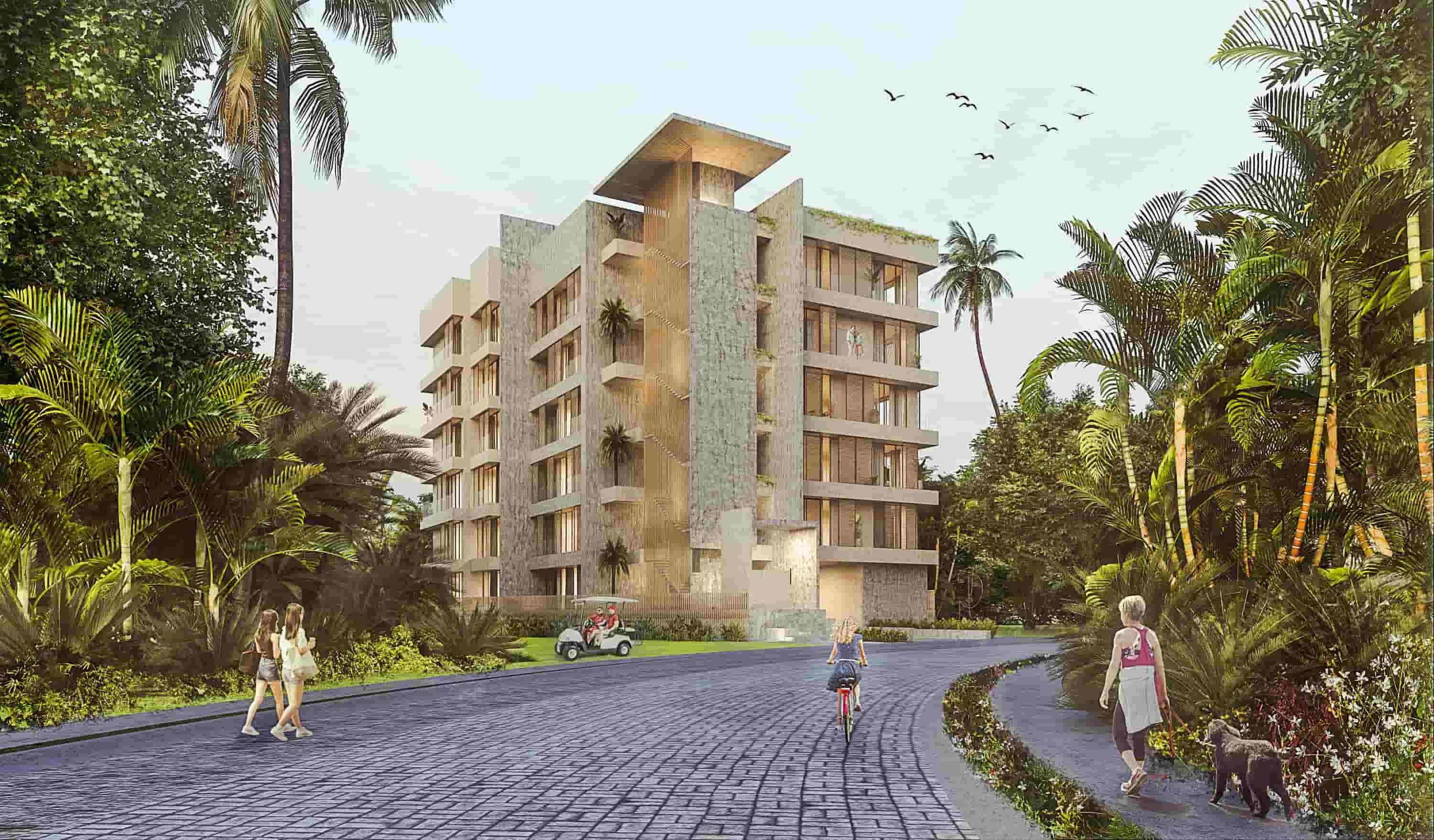 Street-level perspective of Batros Marina Residences in Puerto Vallarta, highlighting the elegant entrance and lush landscaped surroundings.