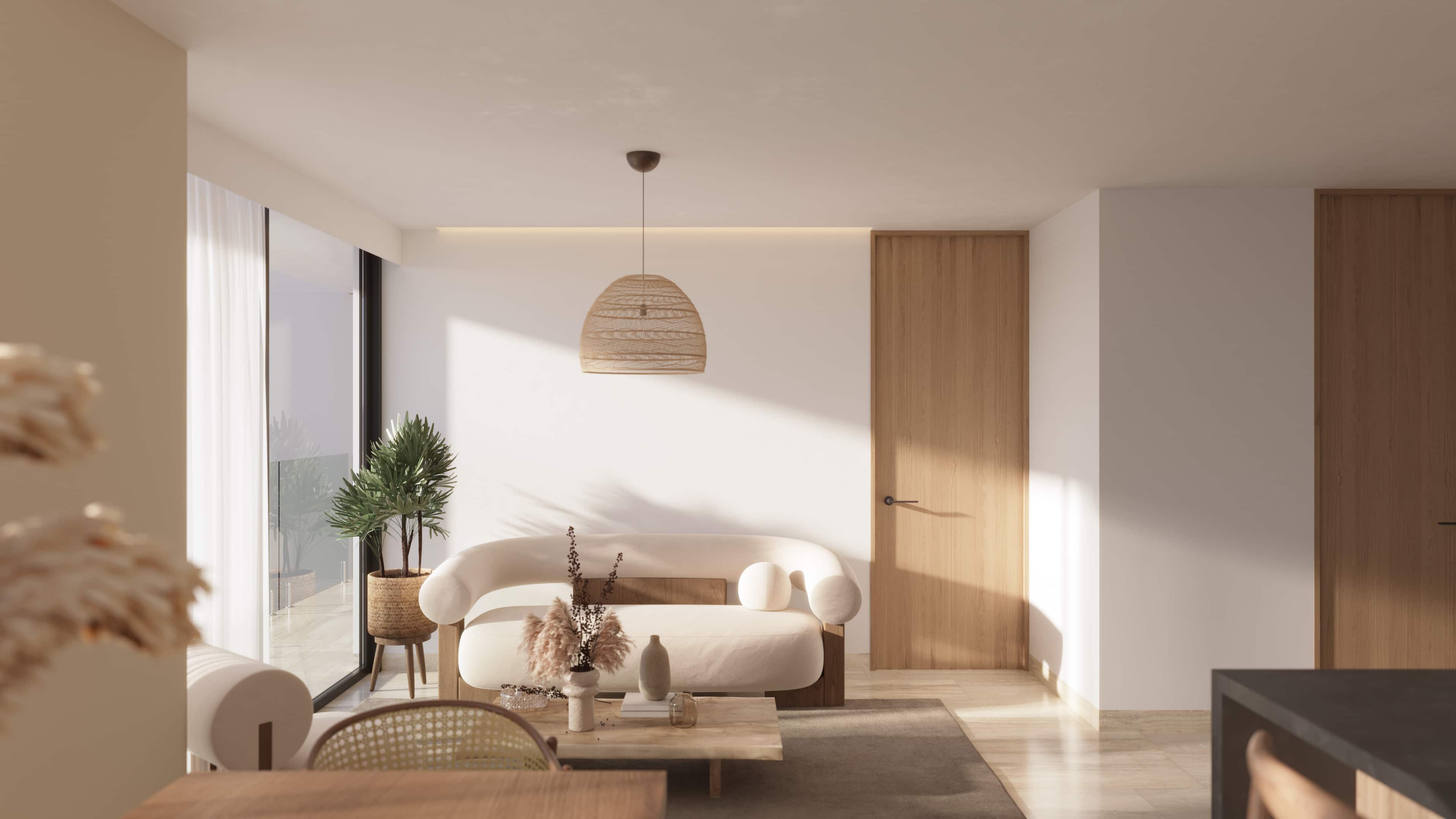 Bright, open-concept living room layout with minimalist furniture and large glass doors leading to a private balcony at Batros Marina Residences.