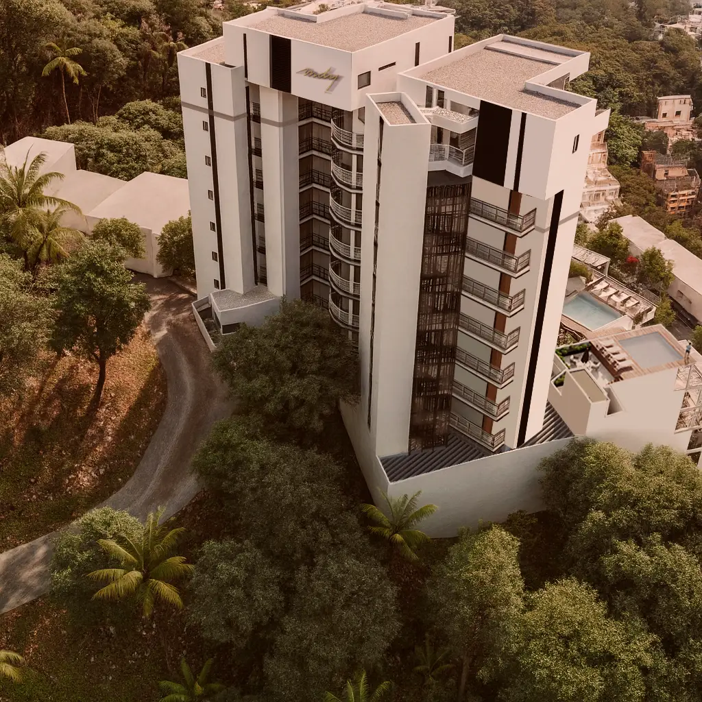 Three-quarter view of the premium MDY residential development on the hillside, emphasizing warm interior lighting and modern facades.