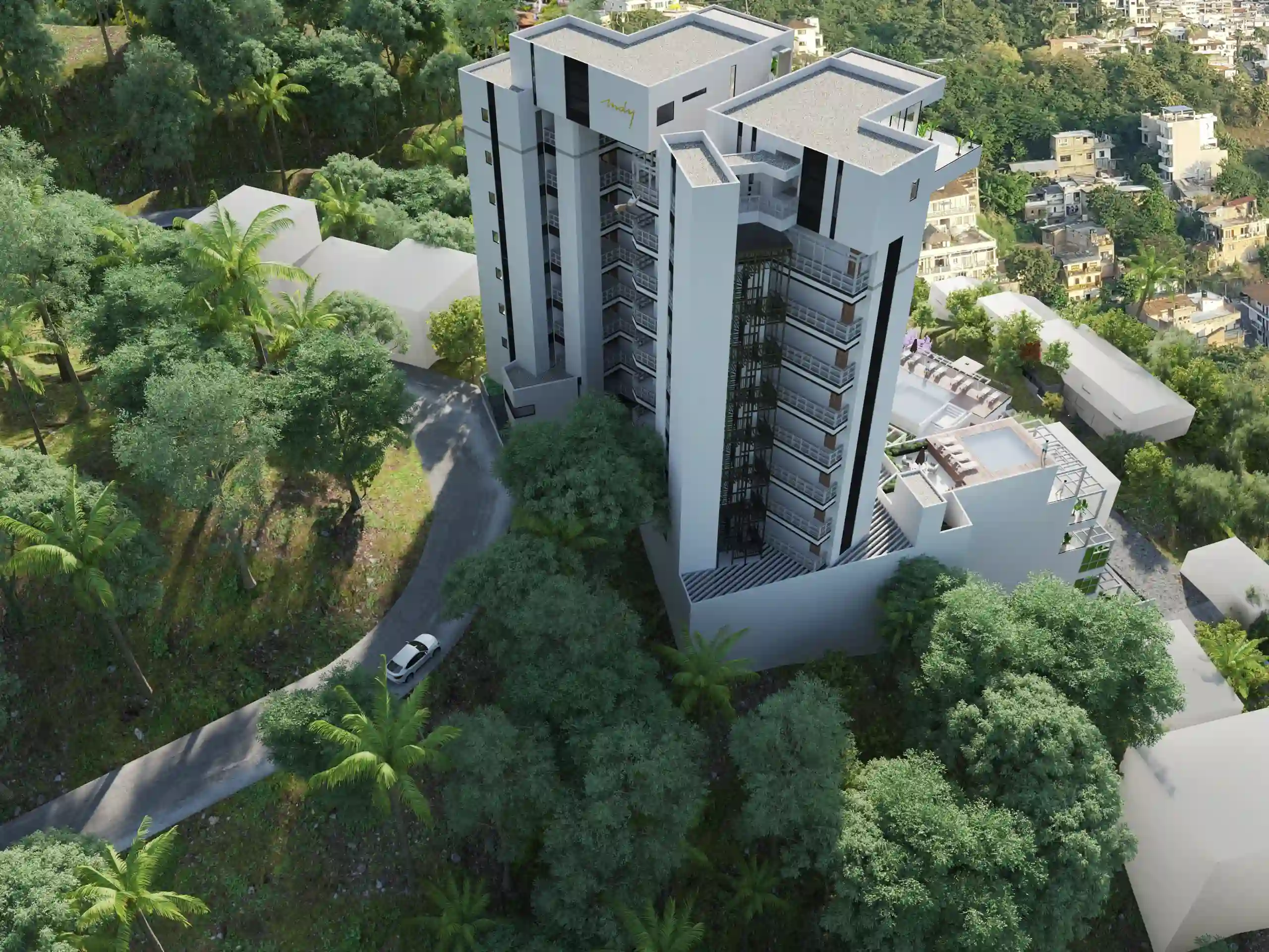 Mid-distance drone shot showing the scale of the MDY residential complex surrounded by lush tropical nature.