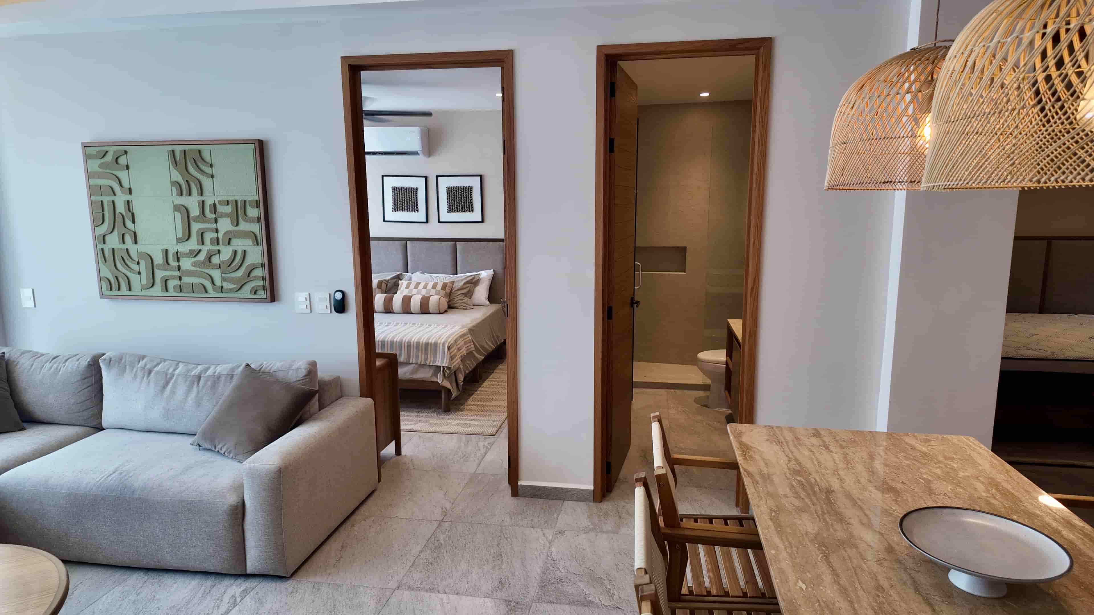 Hallway perspective leading toward the beautifully staged living area, showcasing a seamless TERRA 242 apartment layout.