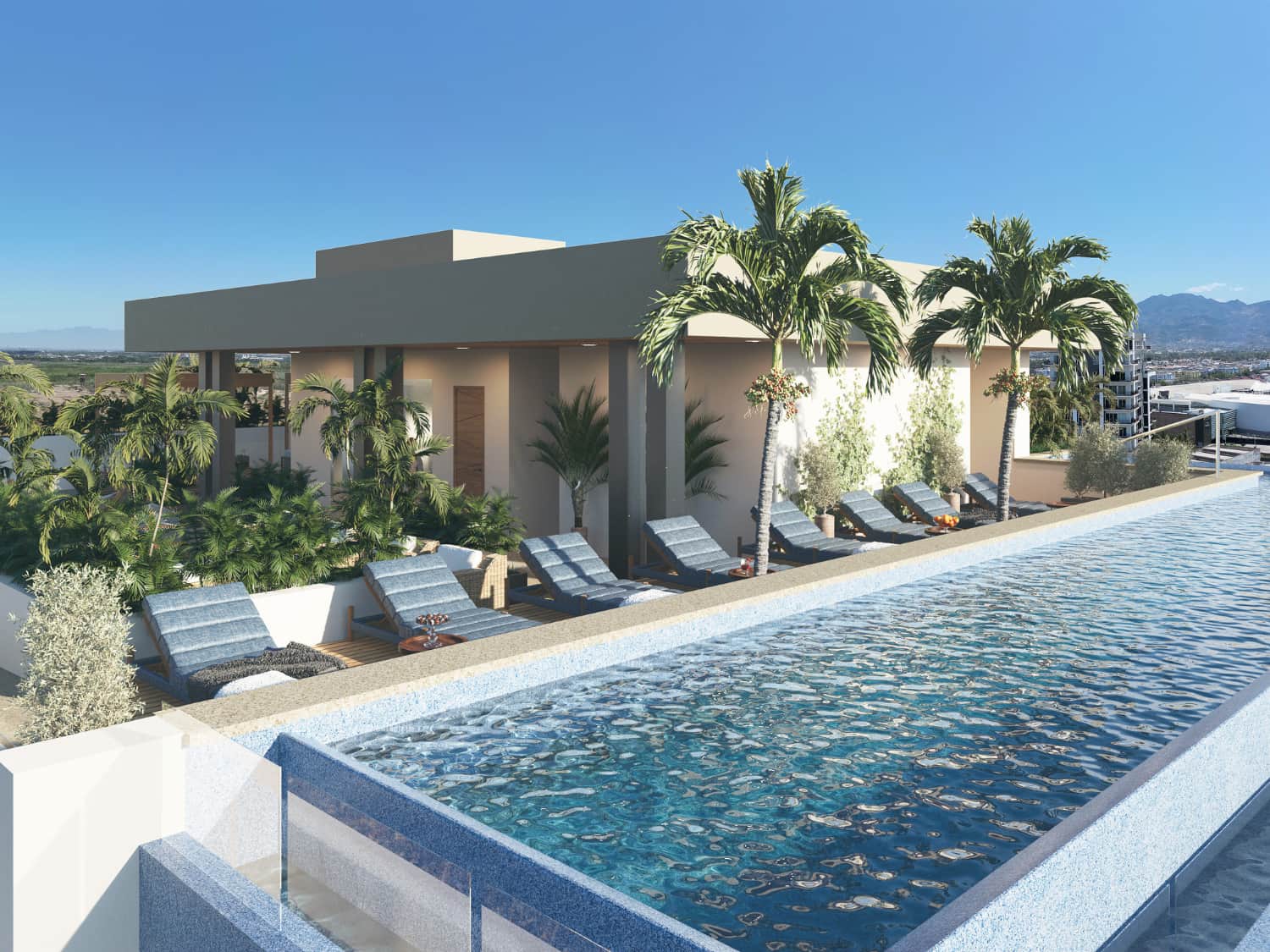 DUE Puerto Vallarta rooftop infinity pool with sun loungers and ocean views