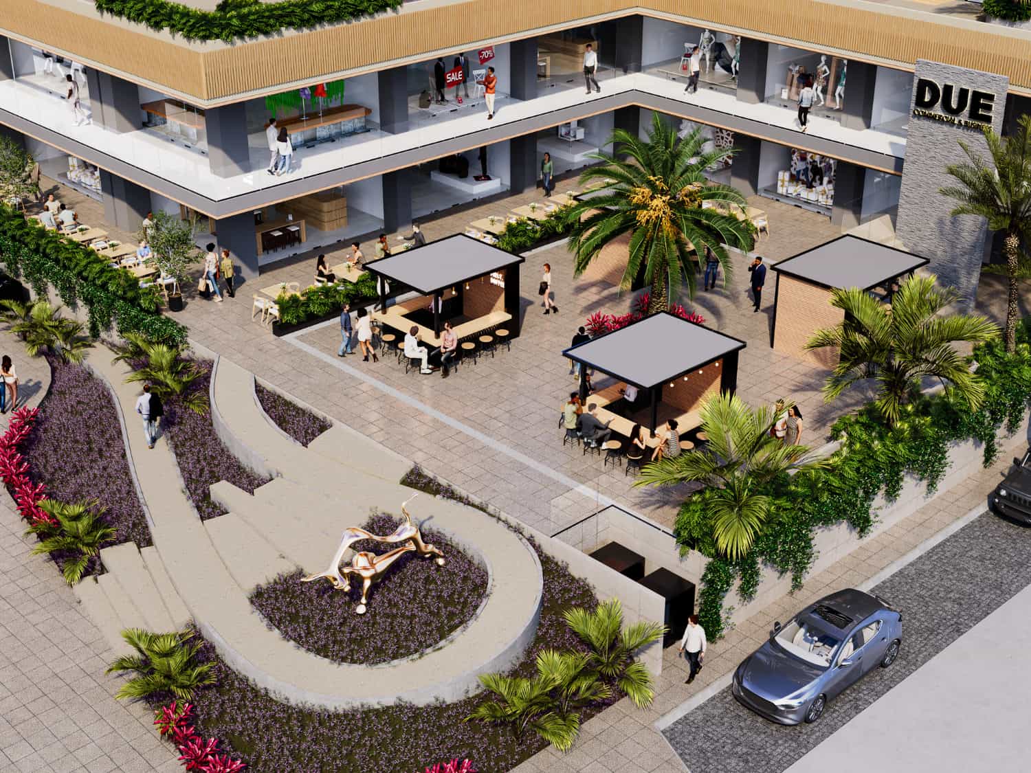 High-angle top view of courtyard plaza, green spaces, and outdoor lounge at DUE