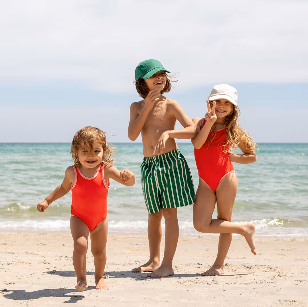 Kids playing on the beach at The Luce Hotel, featured in the Family Fun Package offer