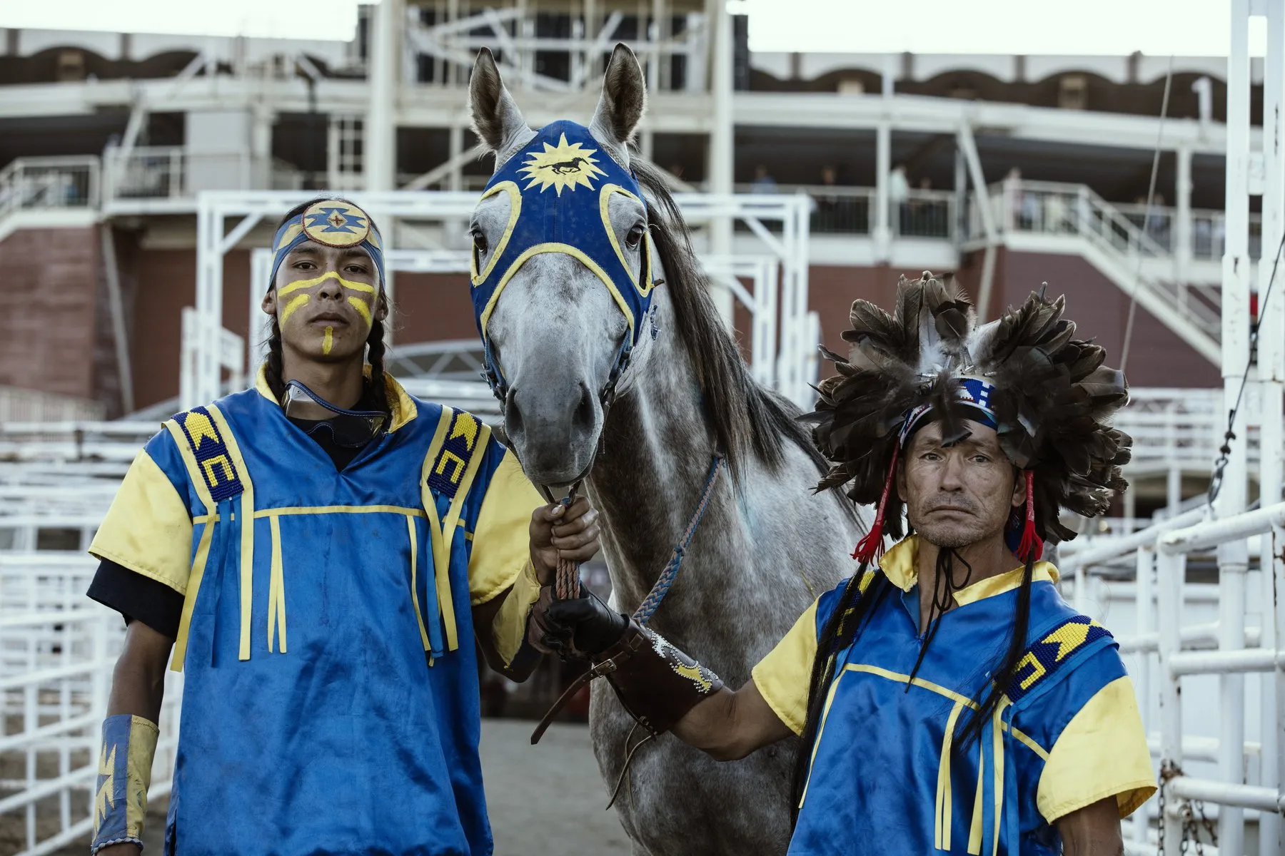 Cody Big Tobacco (L) and Allison Red Crow (R) with one of their Thoroughbred horses at the Calgary Stampede, July 2018.