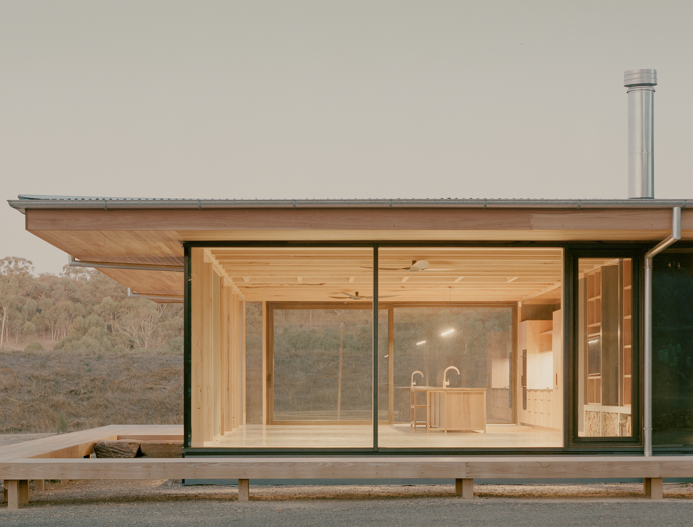 prefabricated fully glazed facade with large eave