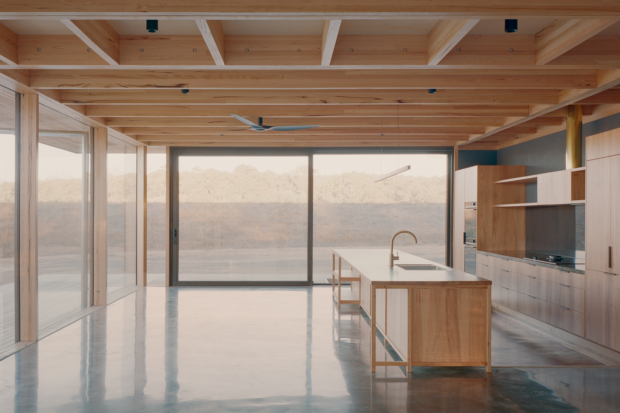 prefabricated fully glazed facade exposed timber ceiling