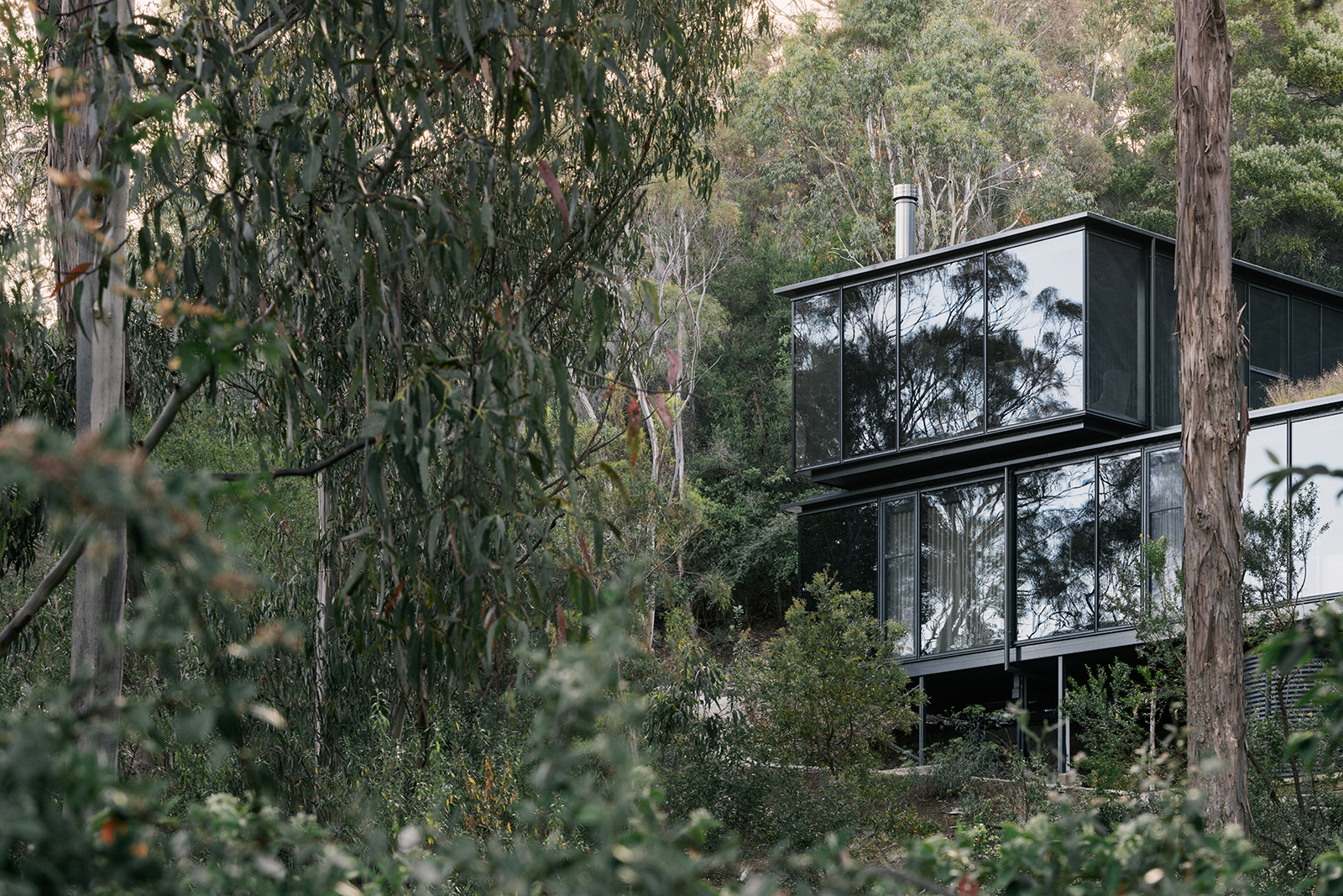 prefabricated steep site fully glazed facade