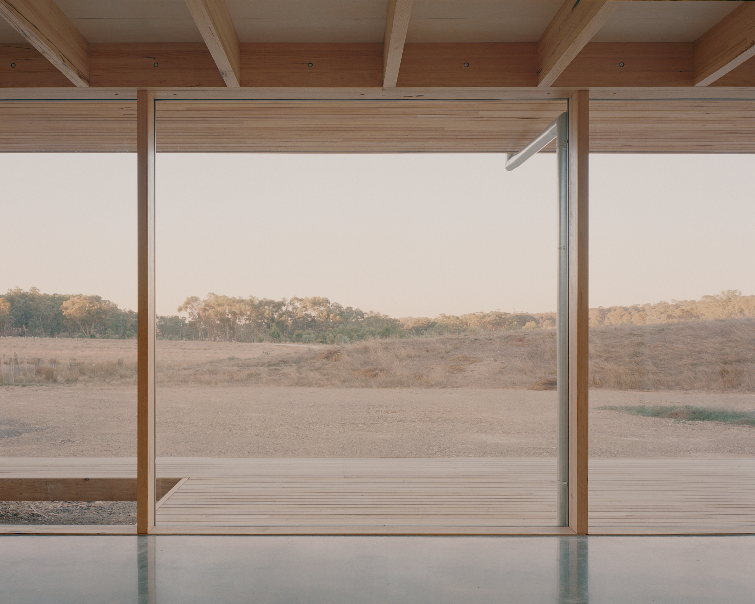 prefabricated fully glazed facade exposed timber ceiling