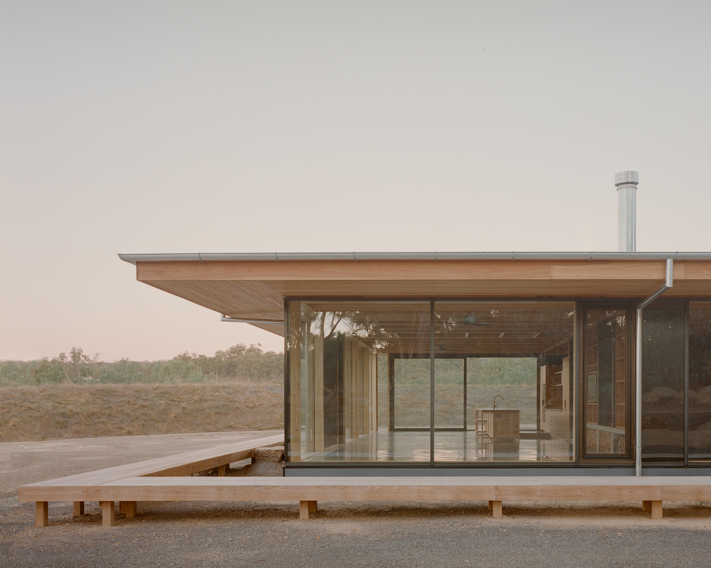 prefabricated fully glazed facade exposed timber ceiling